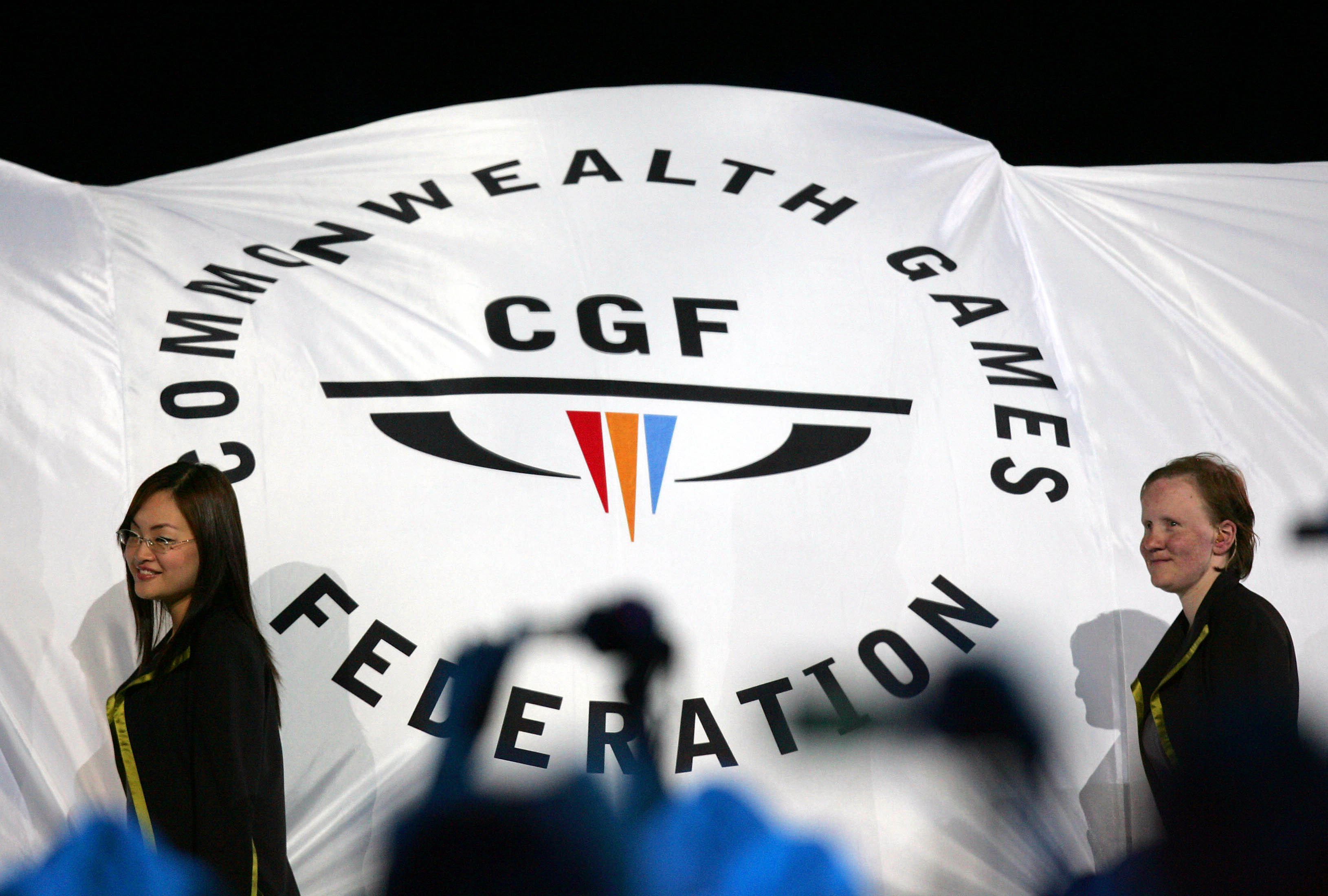 The Commonwealth Games Federation flag is carried into the arena during the Commonwealth Games opening ceremony in Melbourne, Australia on March 15, 2006. Photo: AP