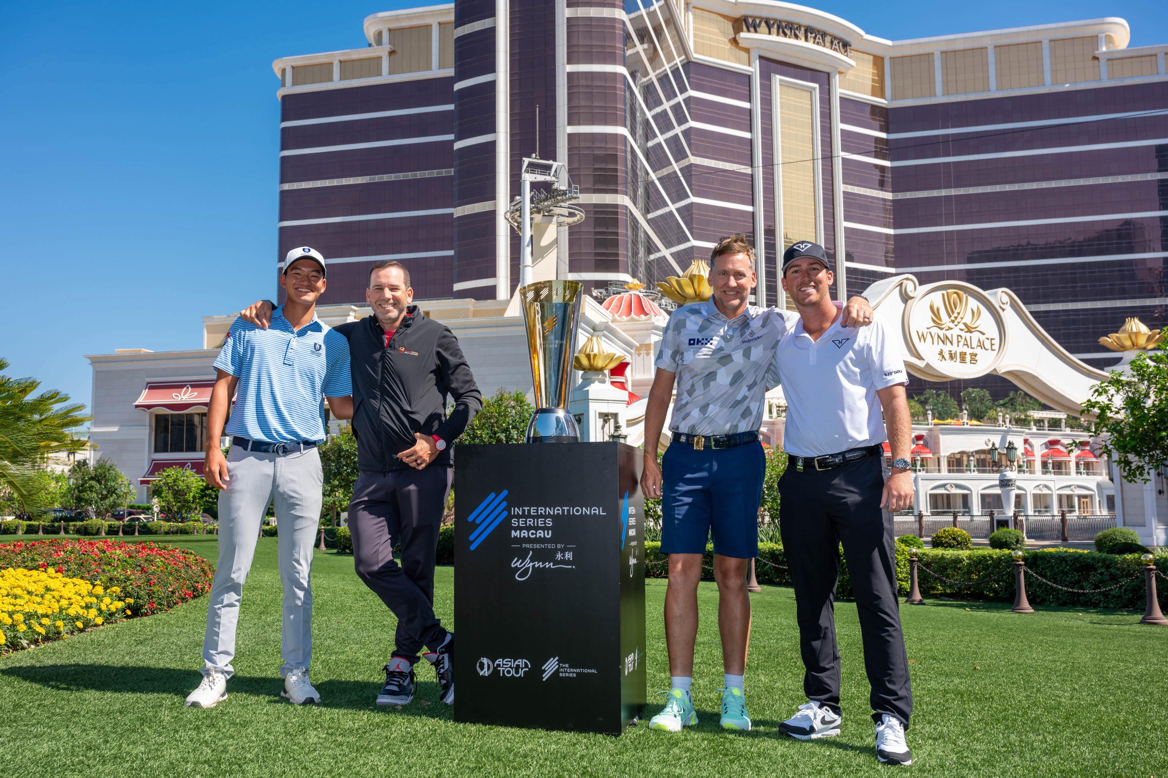 Taichi Kho, Sergio Garcia, Ian Poulter and Andy Ogletree with the International Series Macau trophy on the grounds of Wynn Palace in Macau on Tuesday. Photo: Asian Tour