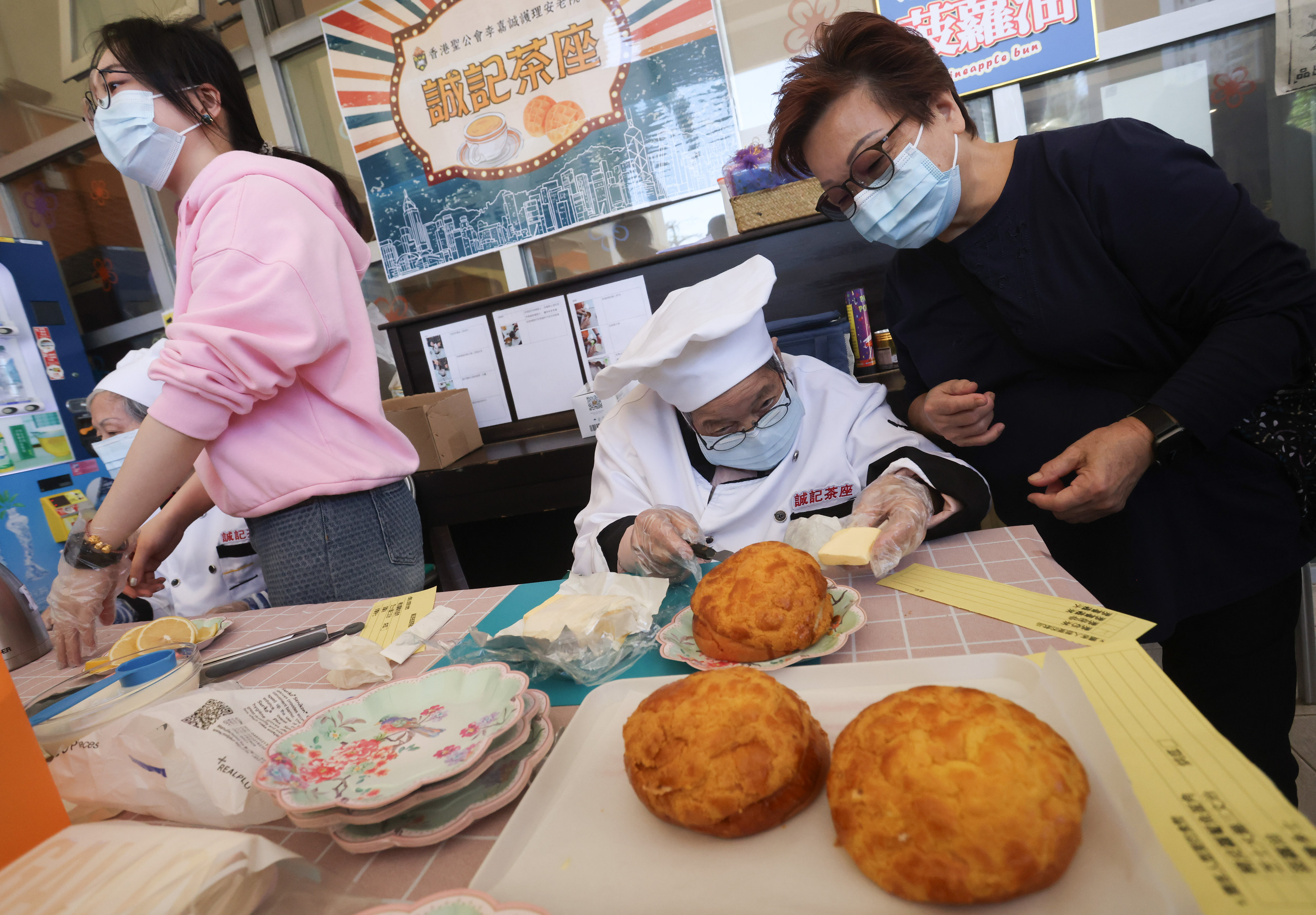 Mandy Lau watches over her 93-year-old Wong Shui-ying at Shing Kee Cafe, which has pineapple buns among items on the menu. Jonathan Wong