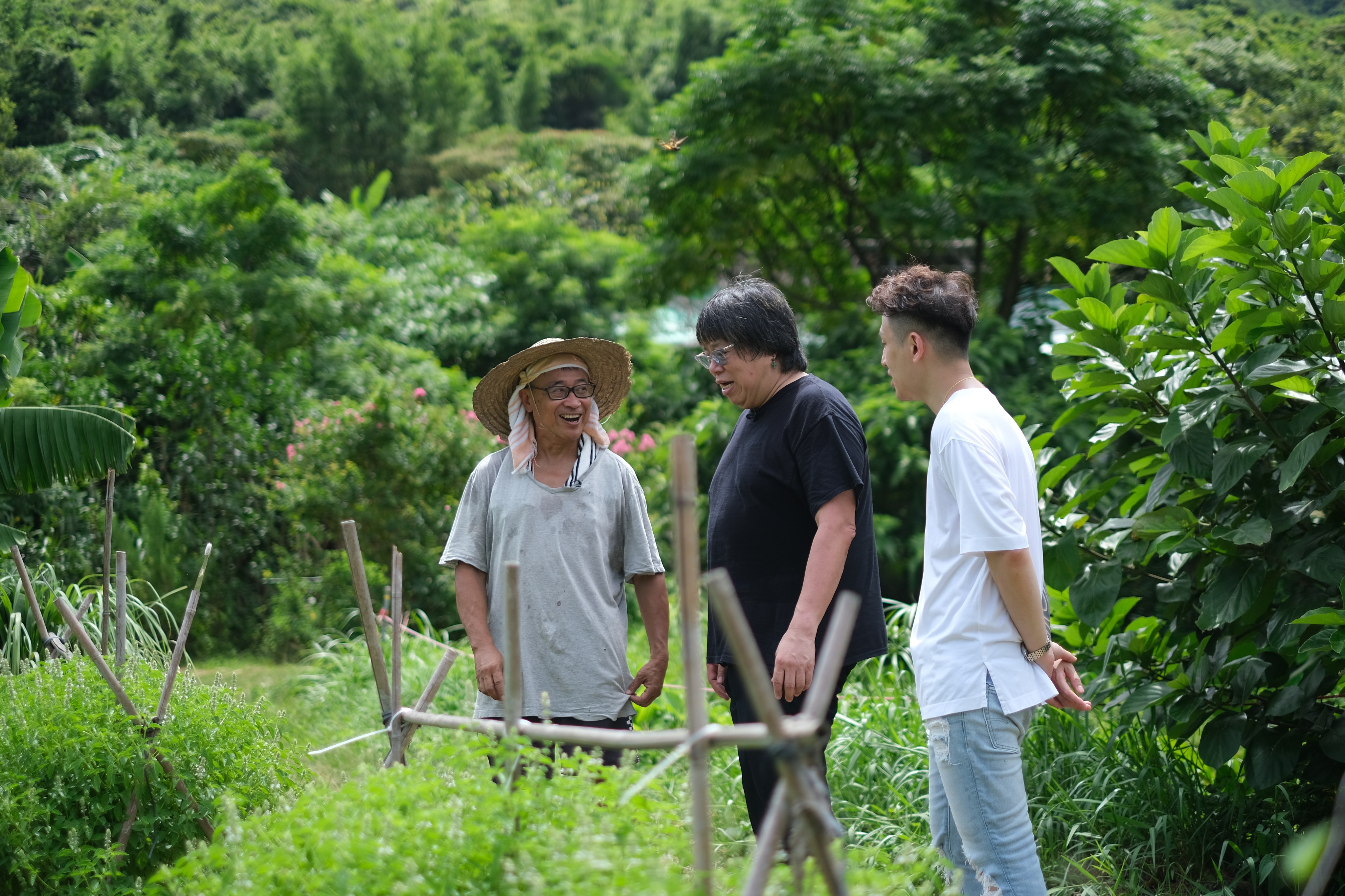 Farm-to-table cooking is the new passion of Hong Kong “Demon Chef” Alvin Leung (centre, with Cafe Bau head chef Kasey Chan and a farmer at Yi O farm). The restaurant sources almost all its ingredients from rural farms around Hong Kong. Photo: courtesy of Cafe Bau