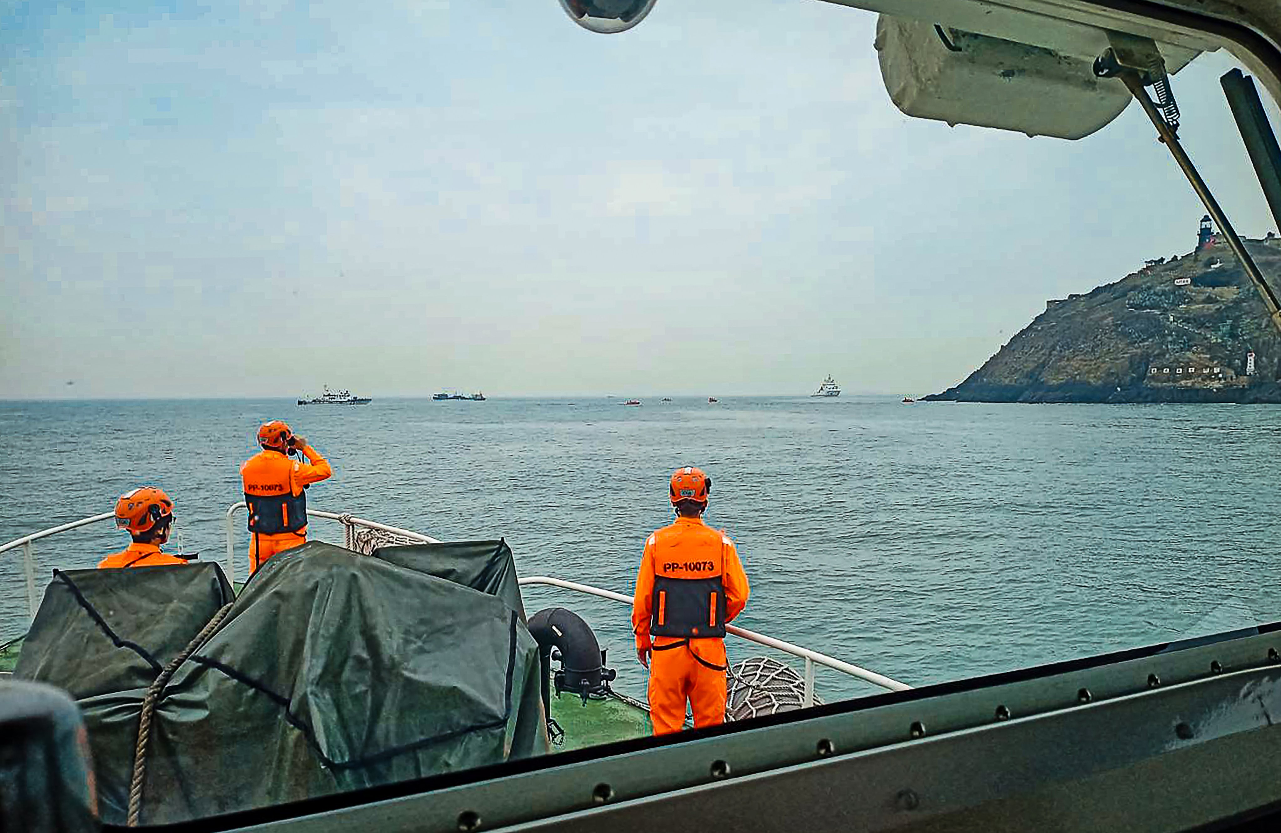 Members of the Taiwanese coastguard during the rescue operation after a Chinese mainland fishing boat capsized on Thursday morning, leaving two of its six-member crew dead and two missing. Photo: CNA