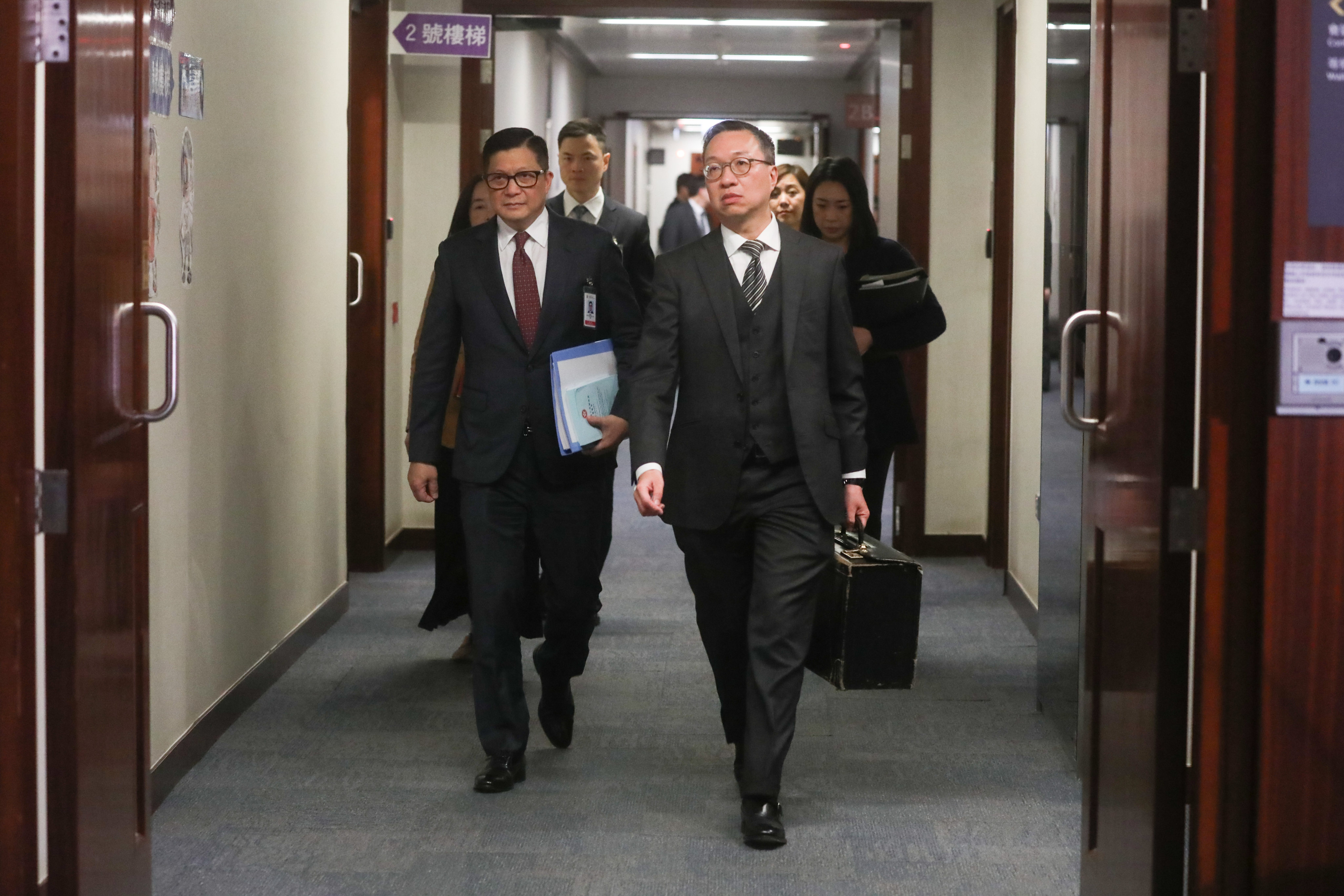 Security chief Chris Tang (left) and justice minister Paul Lam leave a bills committee meeting. Lawmakers started reviewing the bill it once it was gazetted last Friday. Photo: Sun Yeung