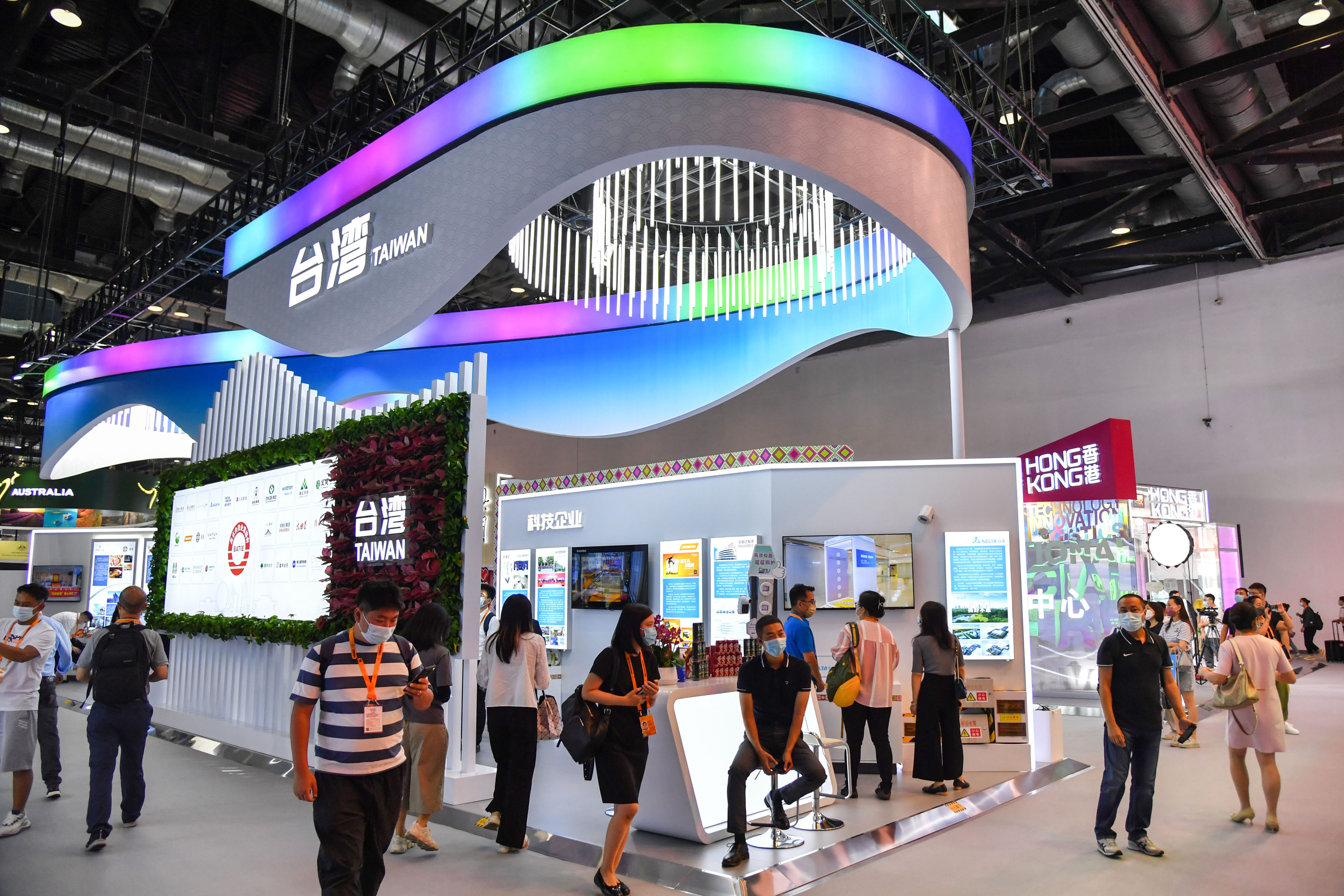 People visit a Taiwan booth at a 2022 trade expo in Beijing. A rising number of surveyed Taiwanese firms say they are considering cuts to their mainland China operations as risks mount. Photo: Getty Images