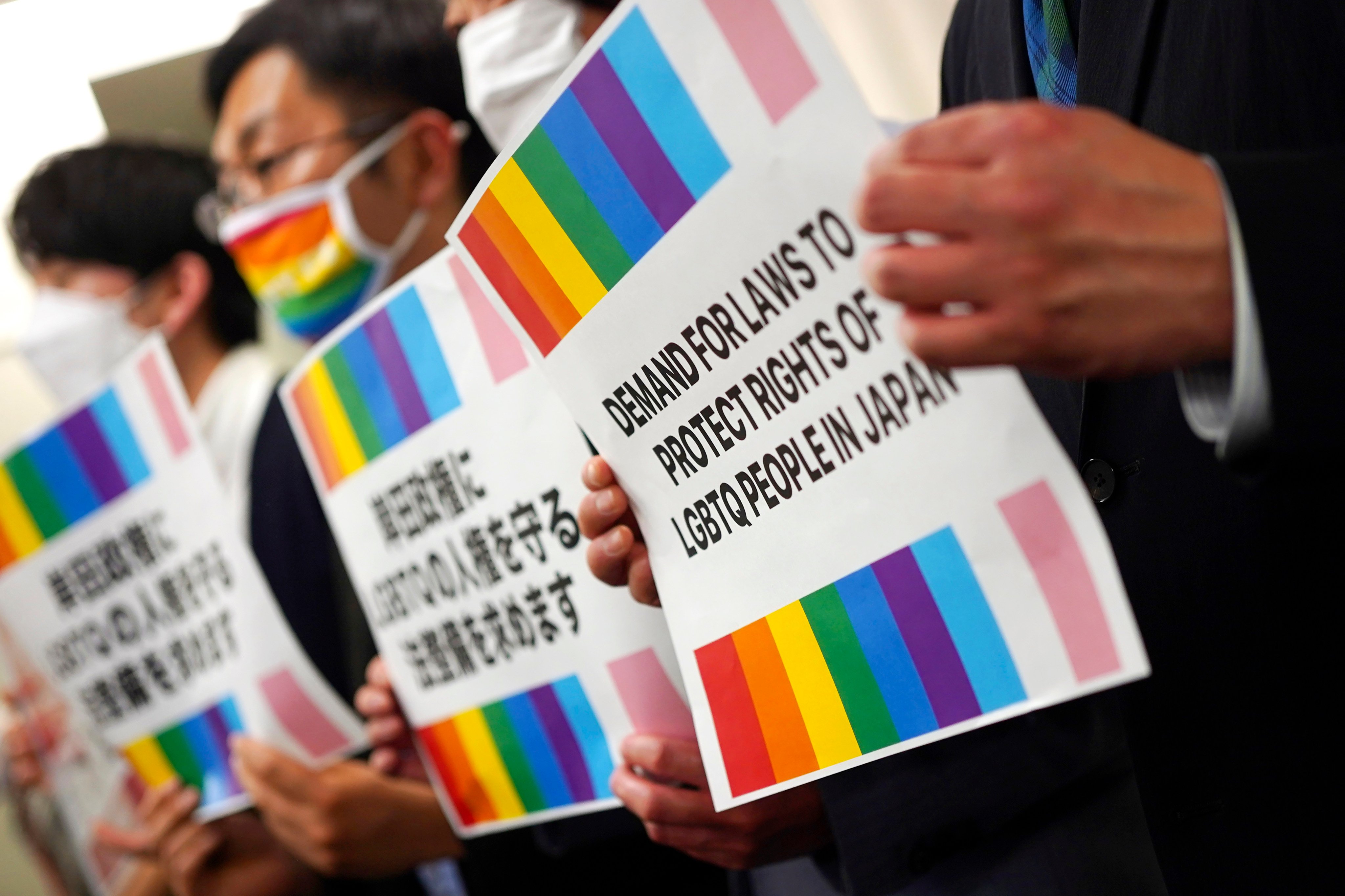 Representatives of Japanese LGBTQ people and rights groups protest on February 7. On Thursday, Japan’s high court says same-sex marriage bar is unconstitutional. Photo: AP