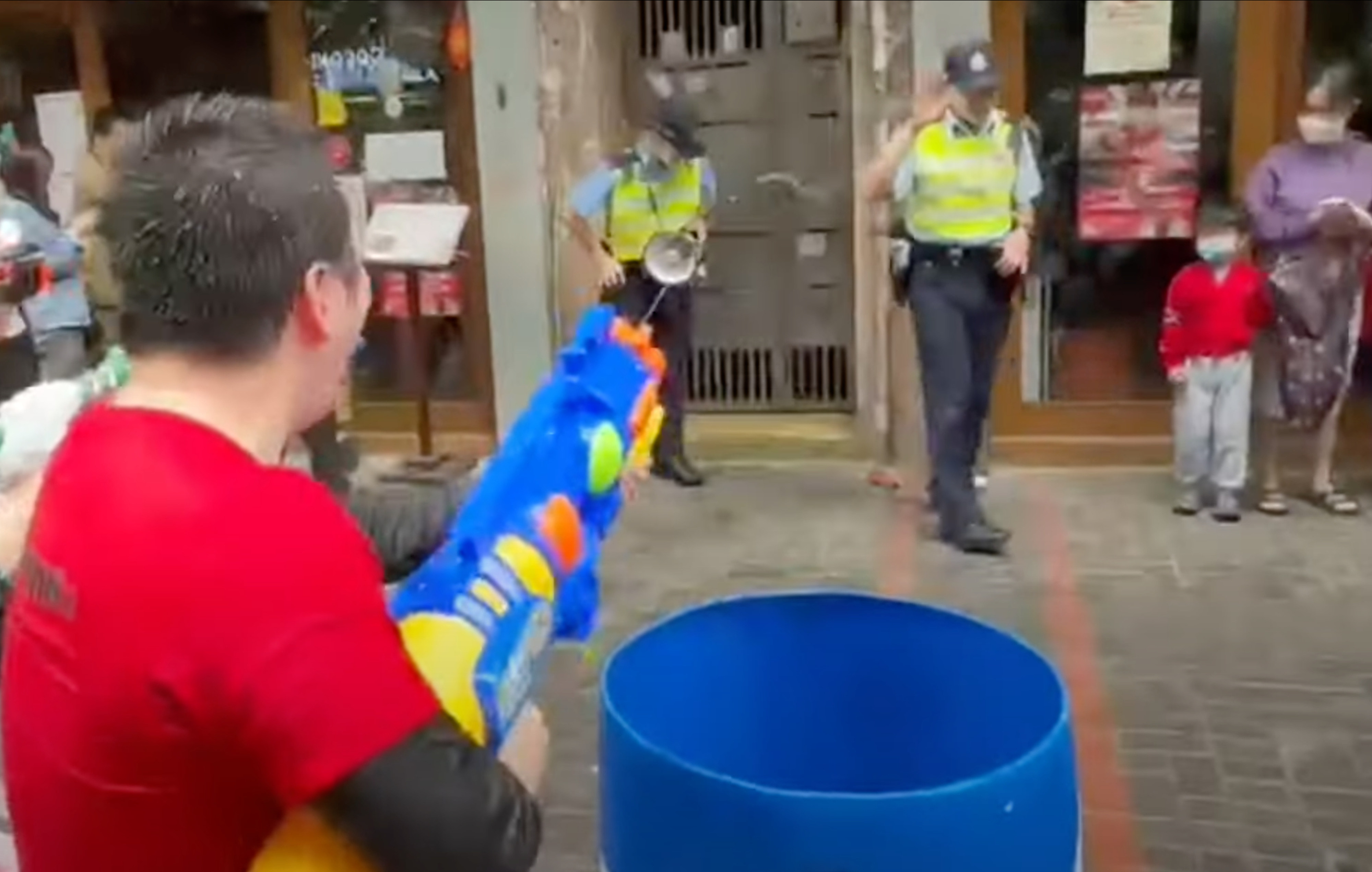 Three men have pleaded not guilty to soaking police officers with water at a Thai new year event last year. Photo: Youtube @Bravedogdog