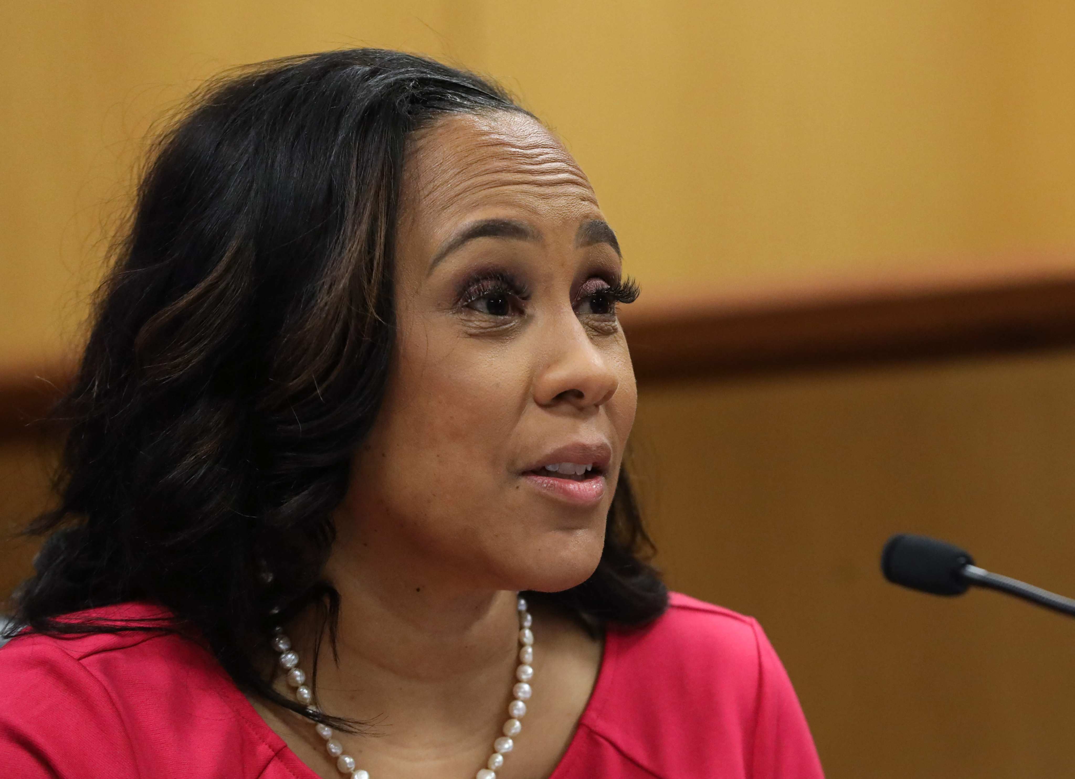 A judge ruled that Fulton County District Attorney Fani Willis, who brought 2020 election interference charges against former US President Donald Trump, can remain on the case if her lead prosecutor, Nathan Wade, with whom she had a romantic relationship, steps aside. Photo: AFP