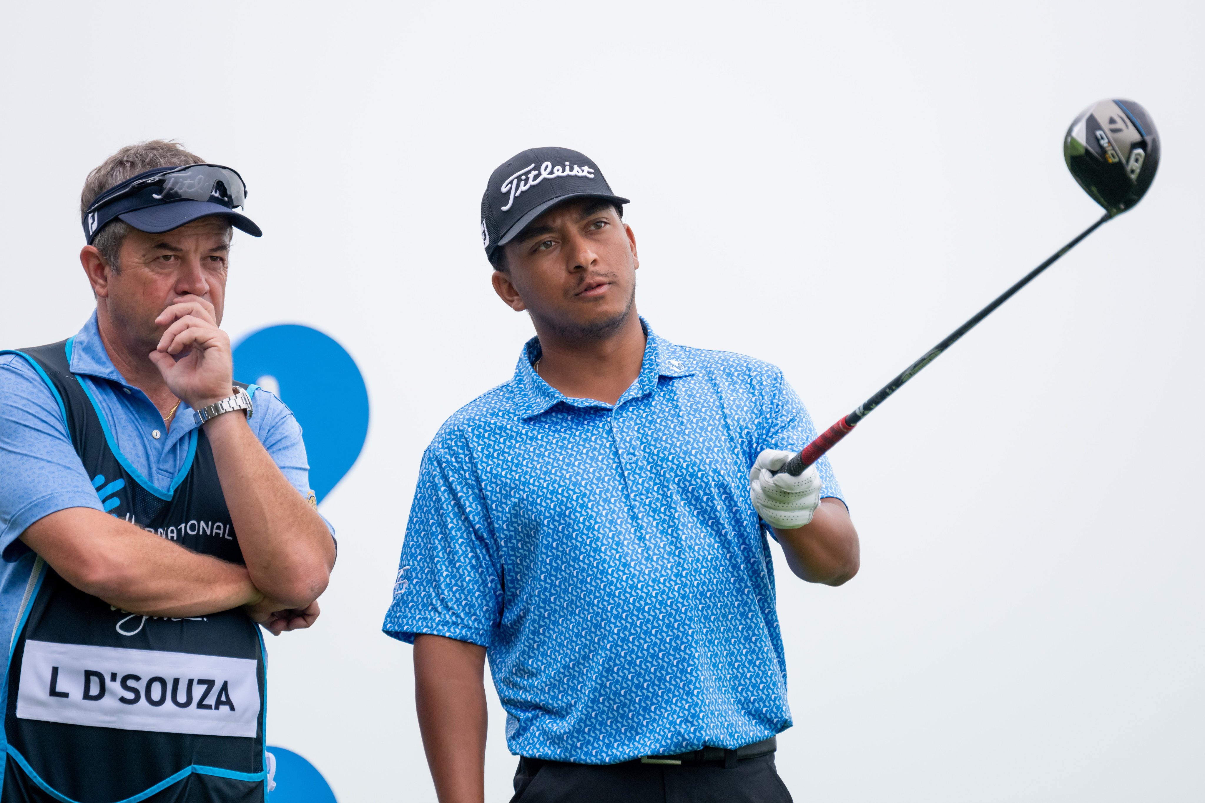 Leon D’Souza (right) and coach/caddie Jonathan Wallet discuss a tee-shot during the third round of the International Series Macau. Photo: Asian Tour