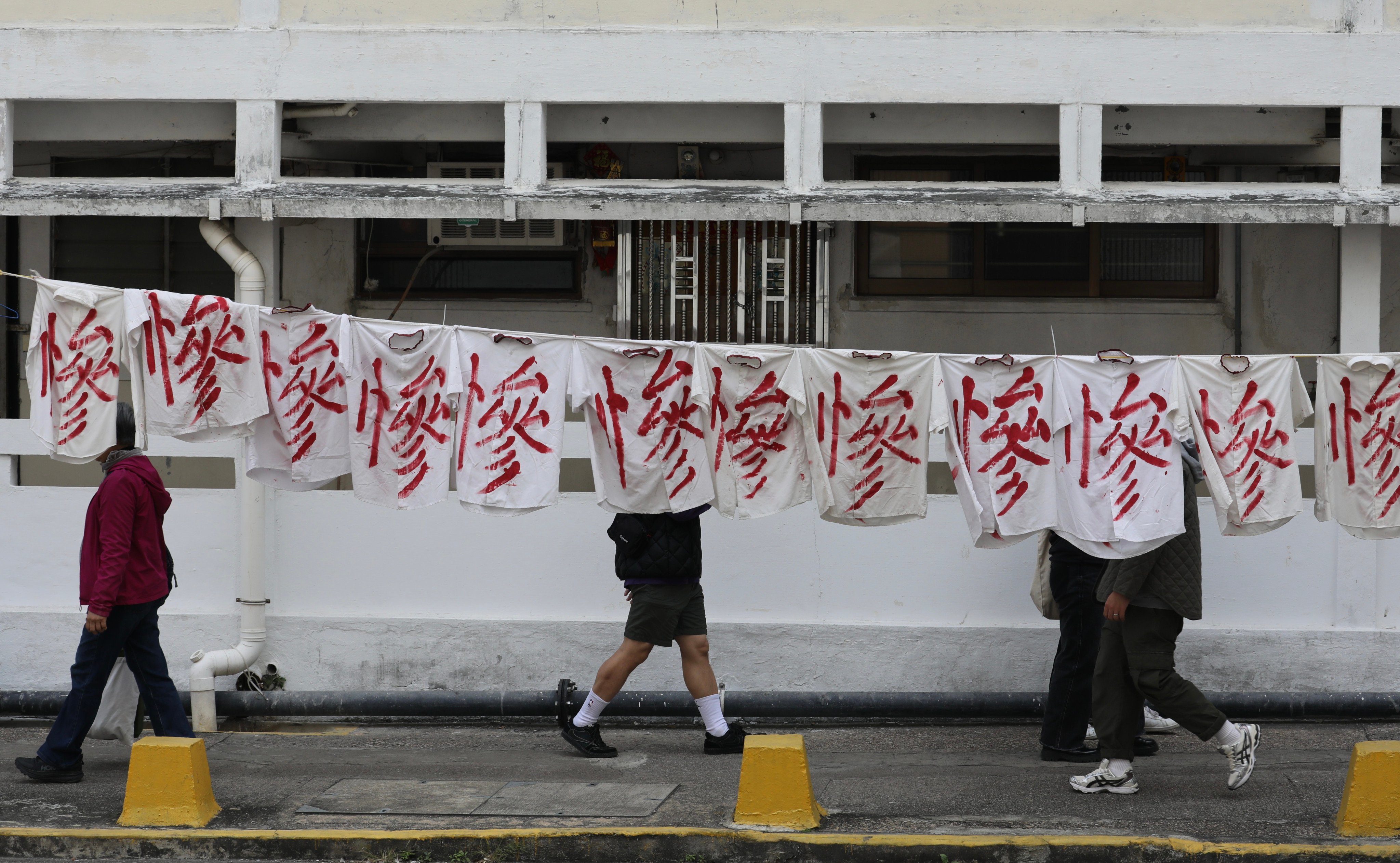 A banner hangs in protest against the relocation of residents from the Tai Hang Sai Estate. Two of the site’s eight blocks were built as early as 1964. Photo: Xiaomei Chen