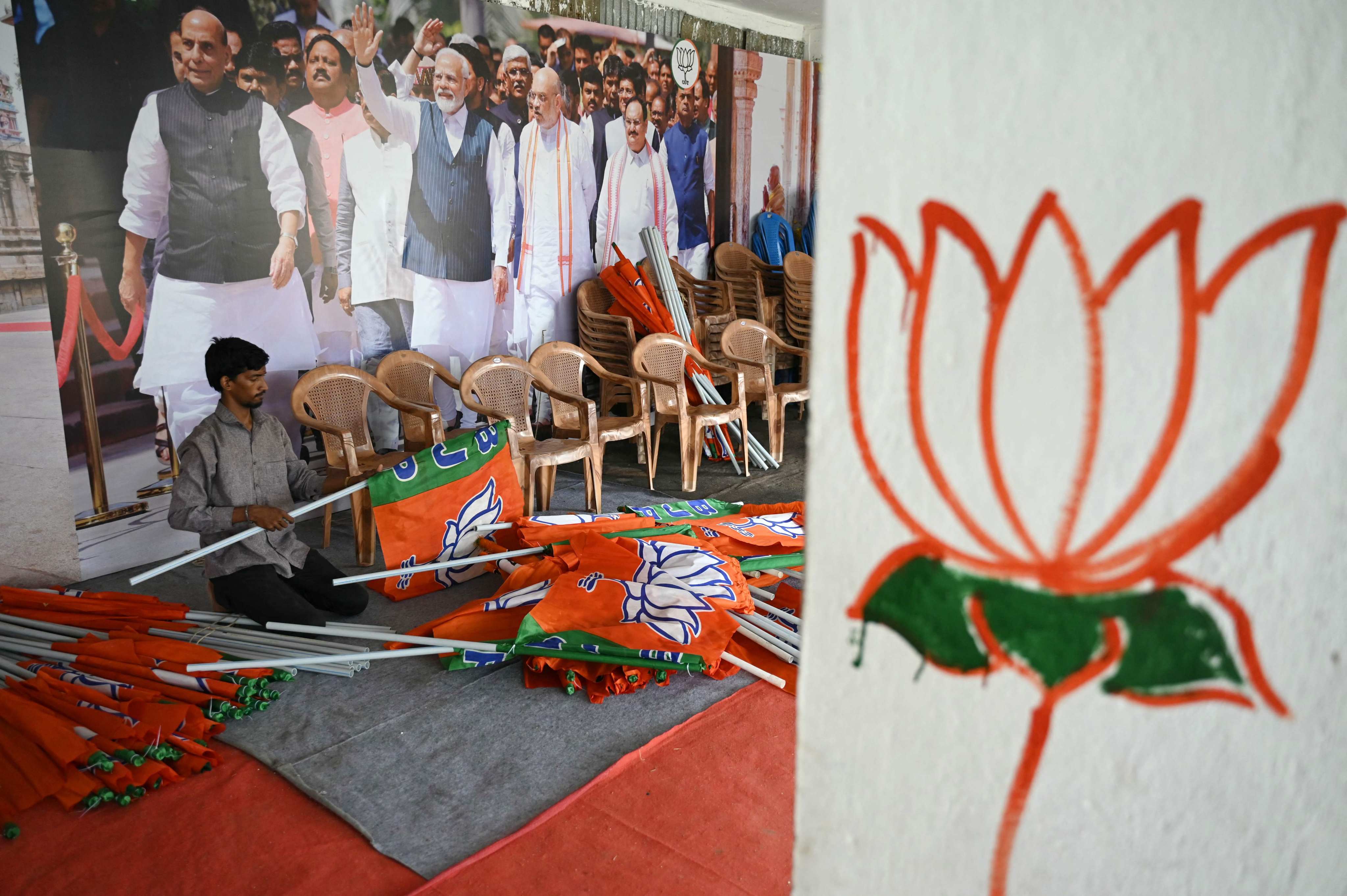 A worker sorts Bharatiya Janata Party (BJP) flags at a BJP election office in Chennai. The election pits two-term strongman Prime Minister Narendra Modi and his regional allies against a bickering alliance of two dozen opposition parties. Photo: AFP