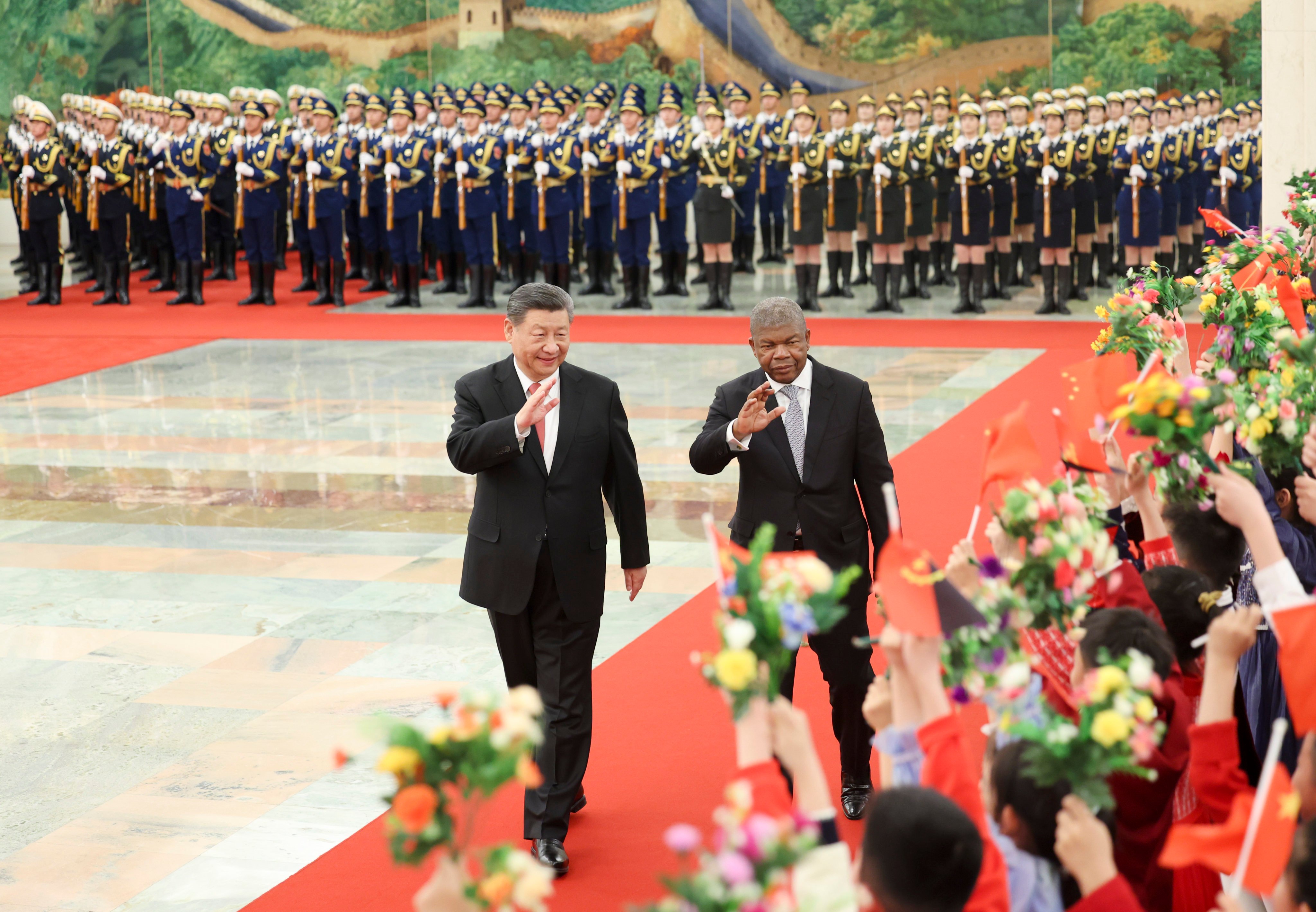 Chinese President Xi Jinping accompanies Angolan President Joao Lourenco during a welcome ceremony at the Great Hall of the People in Beijing on Friday. Photo: Xinhua