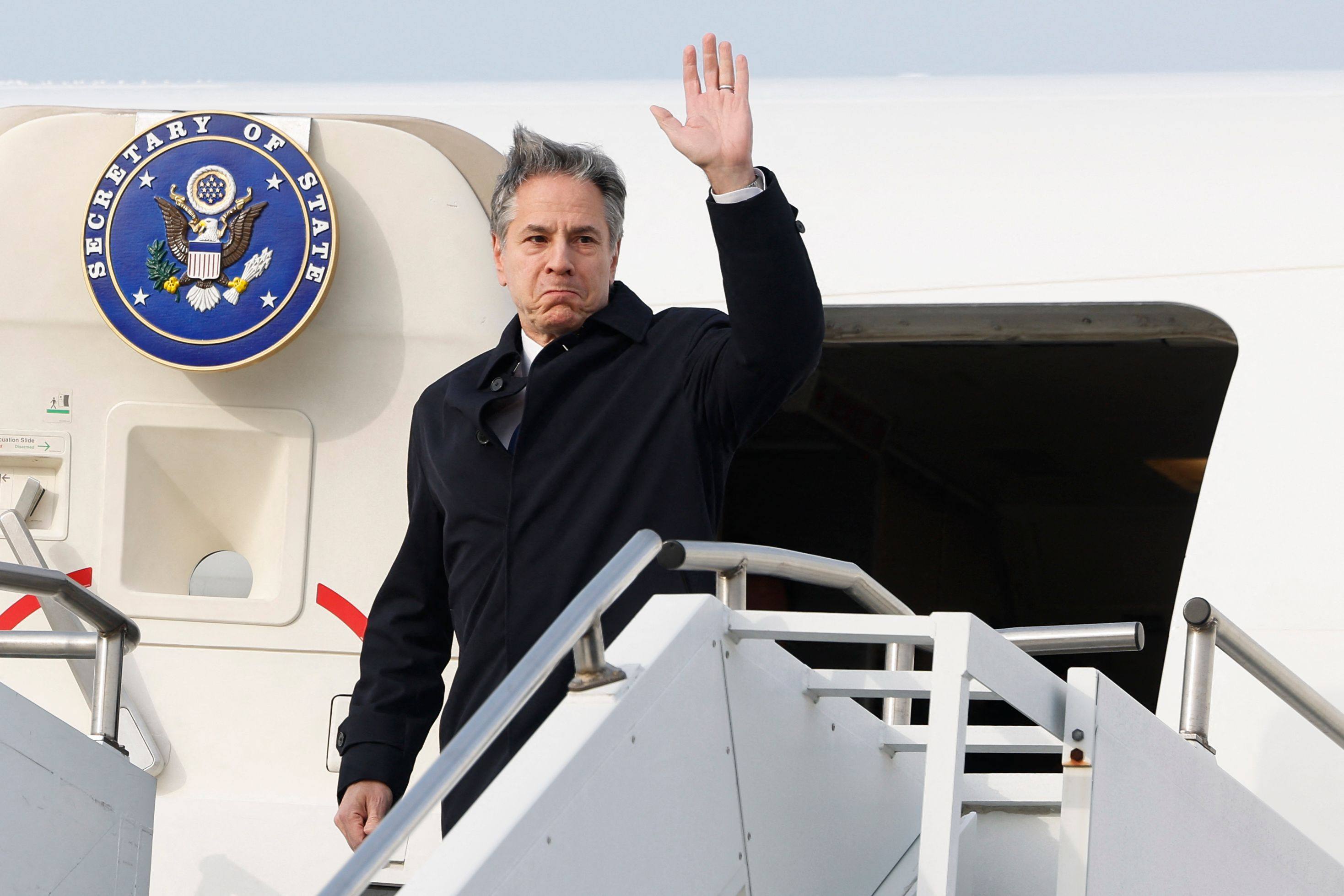 US Secretary of State Antony Blinken waves while disembarking from an aircraft as he arrives at Osan Air Base in Pyeongtaek on Sunday. Photo: AFP