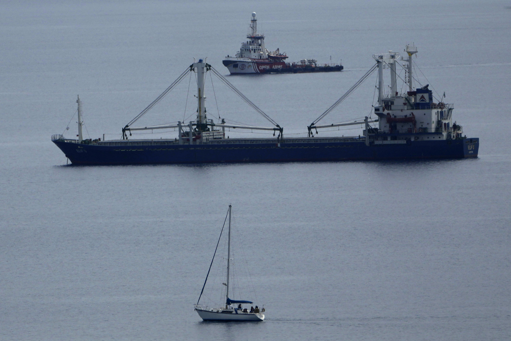 The ship Open Arms (top) belonging to the Spanish aid group by the same name, arrives in Larnaca port after delivering 200 tons of aid to Gaza, on Sunday. Photo: AP