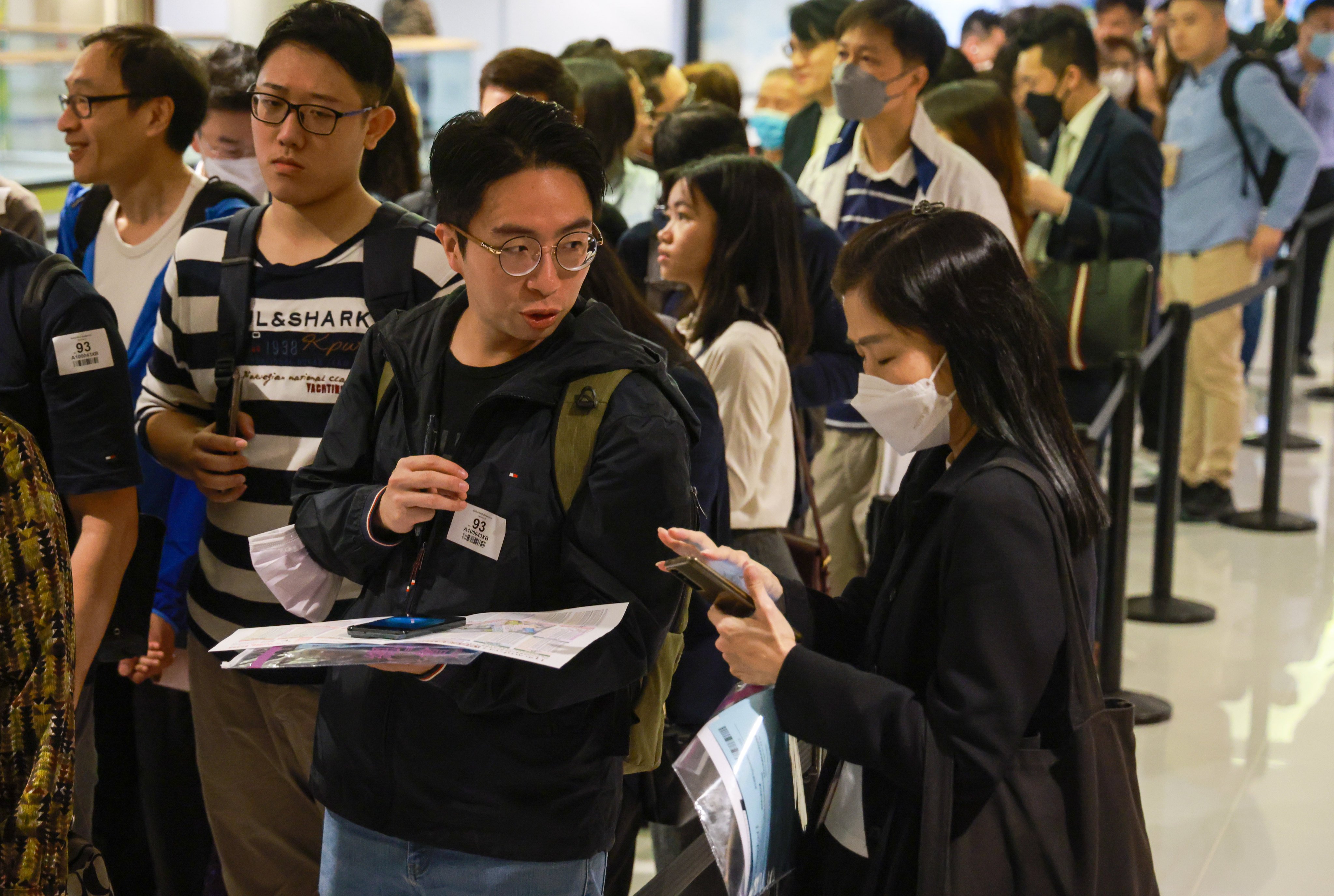 Buyers line up inside the Tsuen Wan sales office of the Uptown East residential project in Kowloon Bay on March 17, 2024. Photo: May Tse