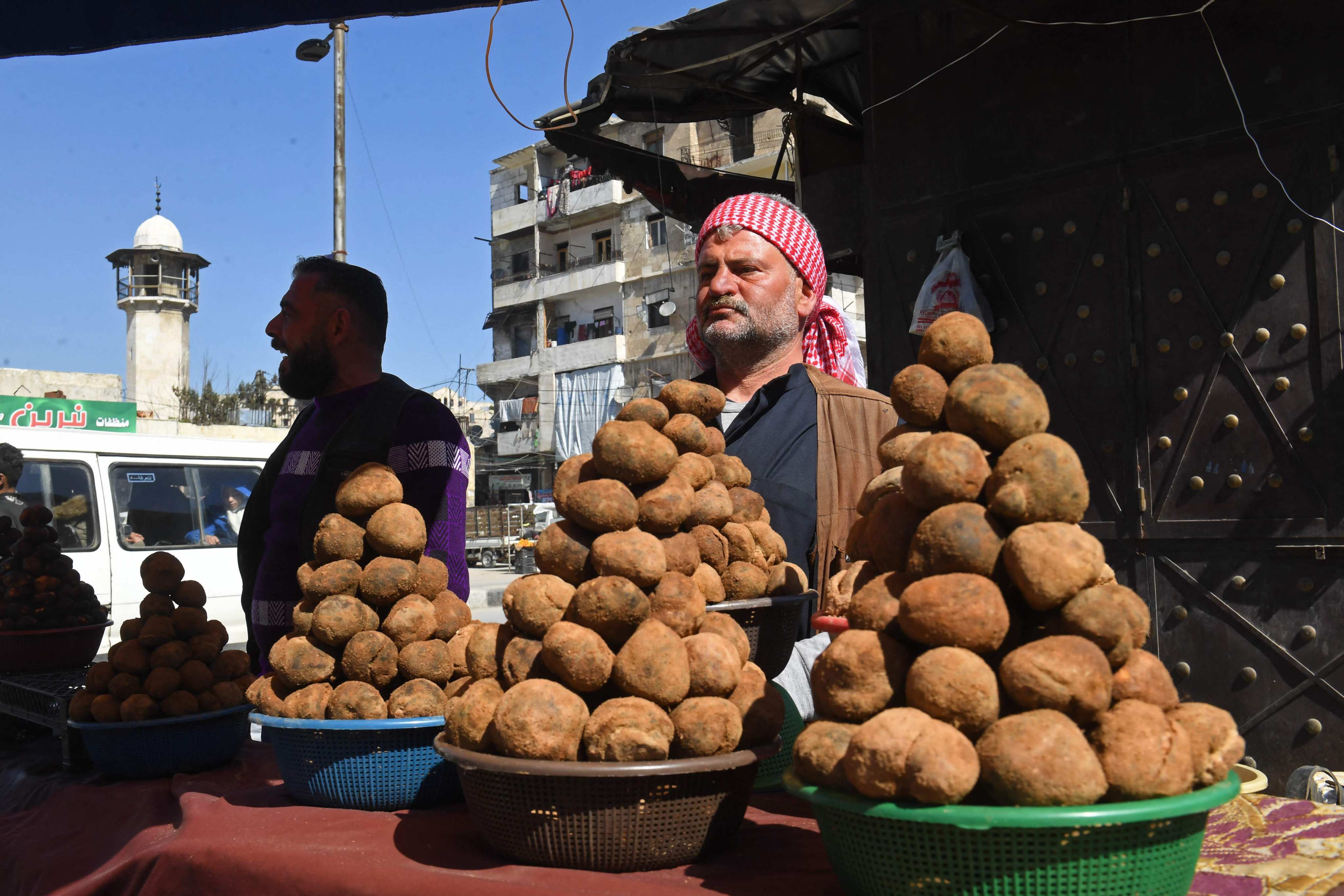Syrian vendors selling truffles at a market in Aleppo, Syria on February 28, 2024. Photo: AFP
