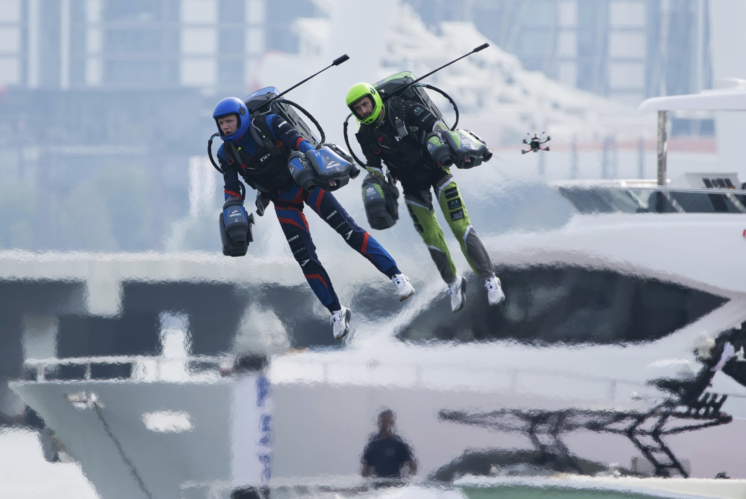 Racers zipped along a route with the skyscrapers of Dubai looming behind them. Photo: AP