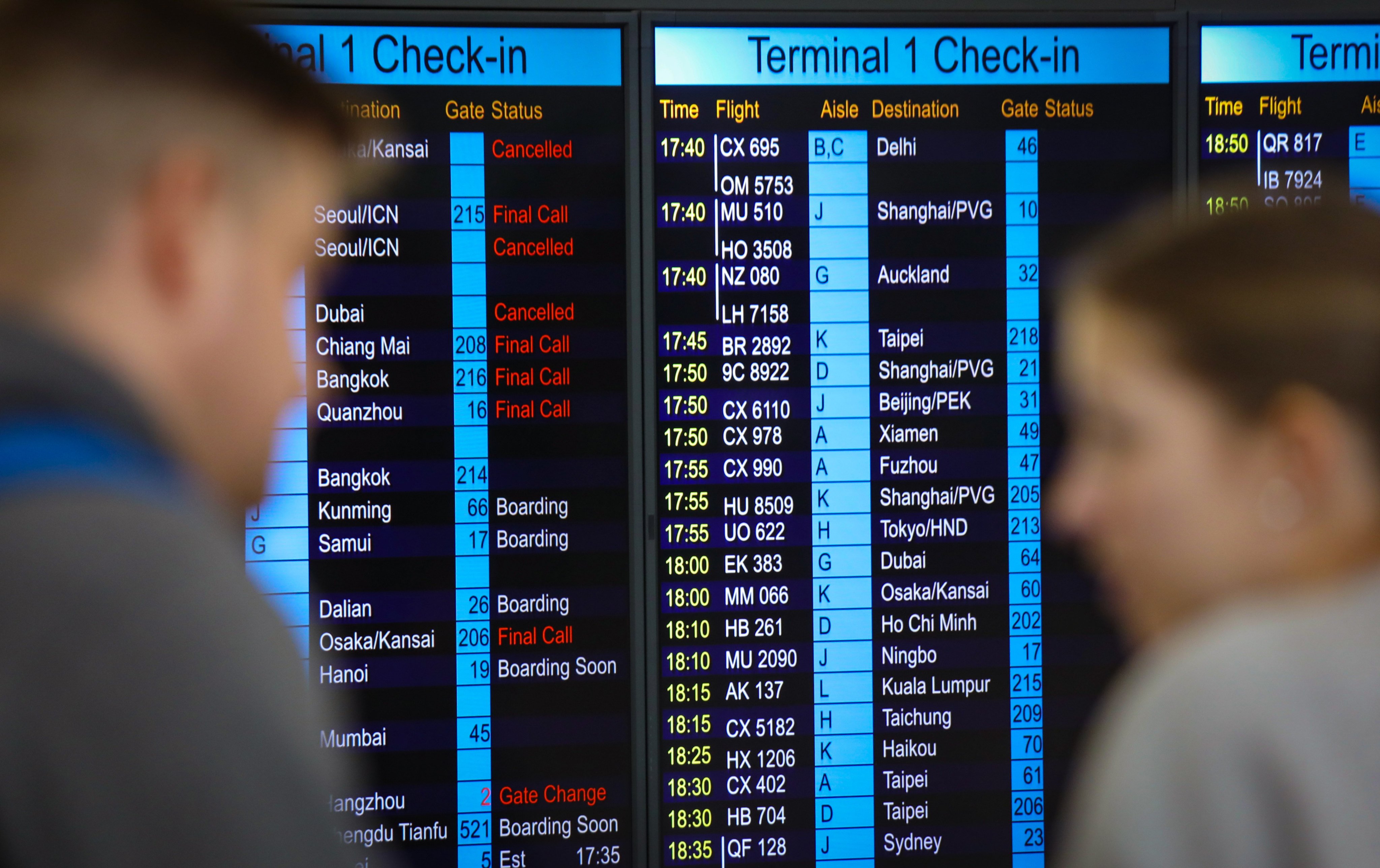 Passengers check information at Hong Kong International Airport. A Legco panel will further discuss the airline’s spate of flight cancellations on Friday. Photo: Xiaomei Chen