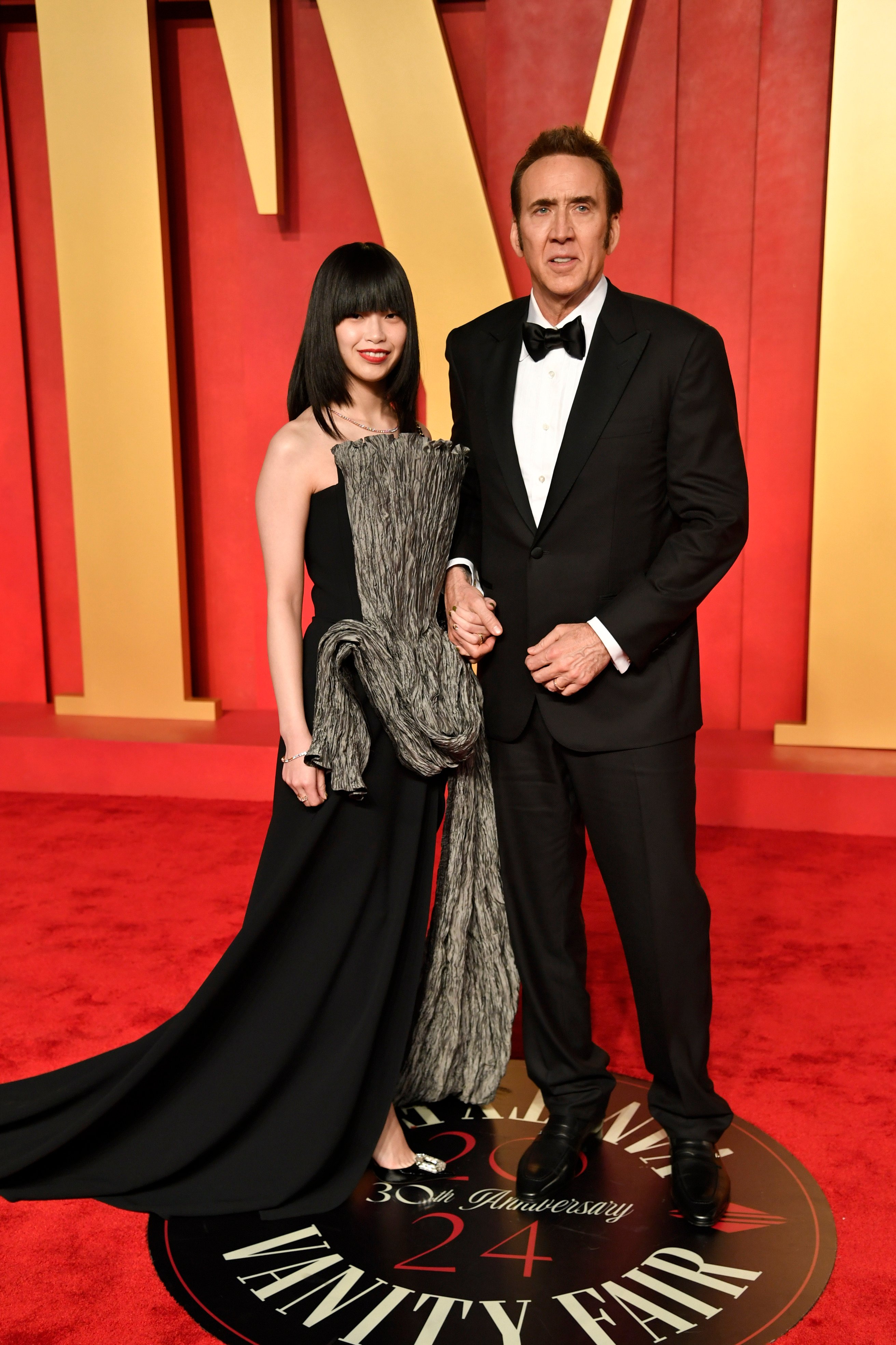Riko Shibata and her husband Nicolas Cage, who’s 32 years her senior, at the Vanity Fair Oscar Party on Sunday March 10. Photo: Invision/AP