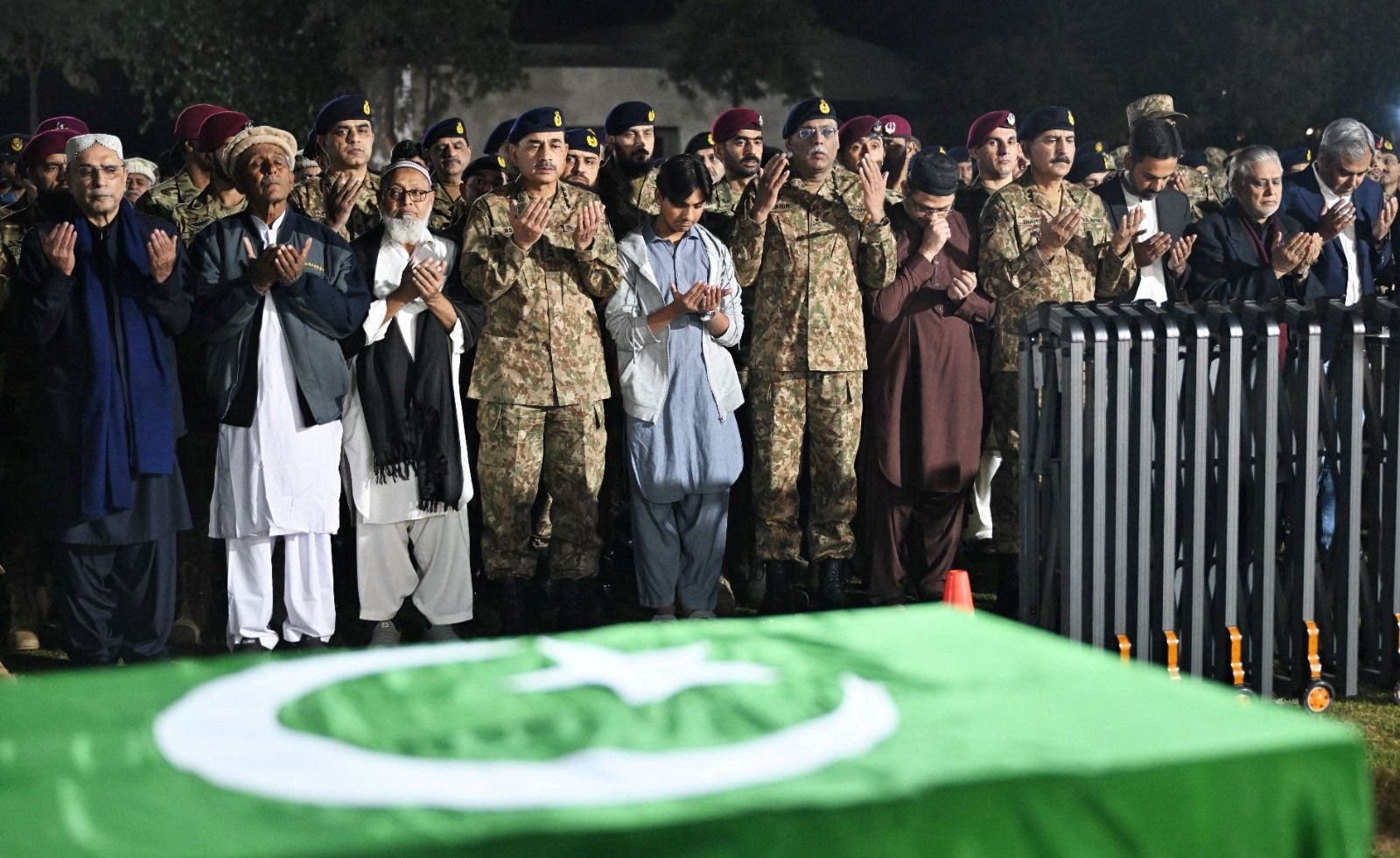 Pakistan President Asif Ali Zardari (left), army officers and others attend the funeral of Lieutenant Colonel Syed Kashif Ali and Captain Muhammad Ahmed Badar, who were killed in an attack on a military post in North Waziristan district on Saturday. Photo: Handout via Reuters