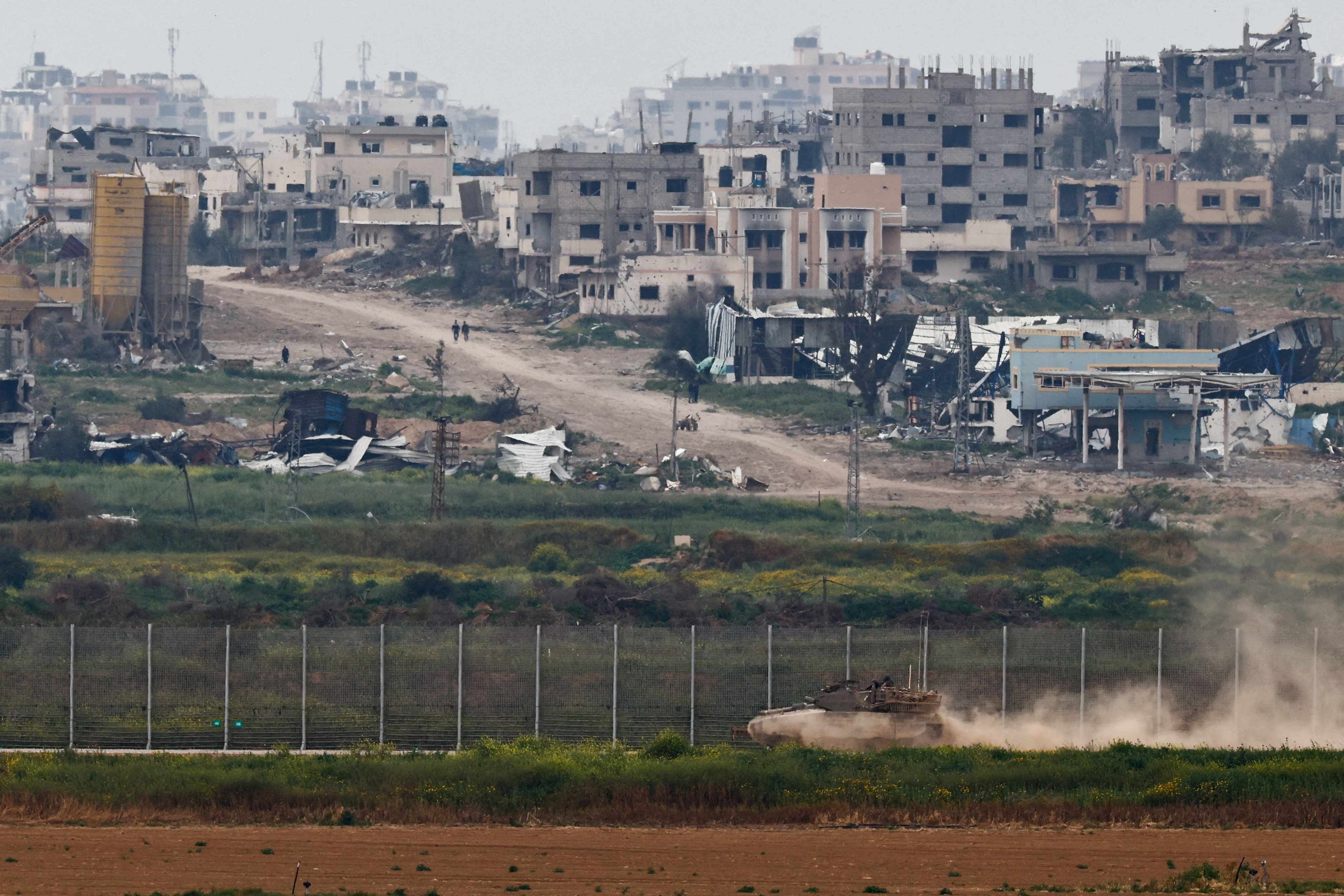 A tank manoeuvring near the Israel-Gaza border. Photo: Reuters