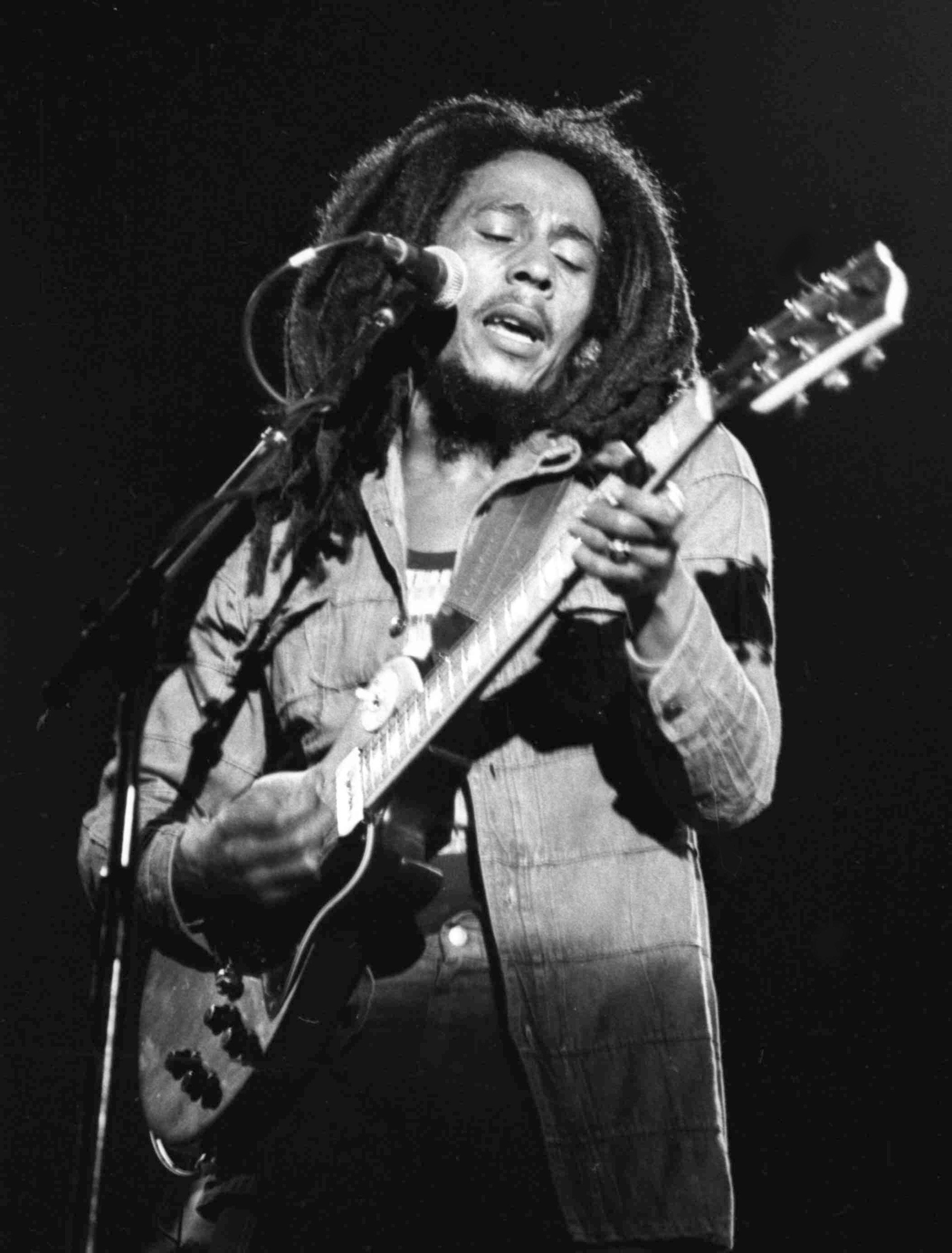 FILE - In this July 4, 1980 file photo, Jamaican reggae singer Bob Marley performs at a reggae festival concert in Paris. The family of Bob Marley are covering his song “One Love” to raise money for coronavirus relief efforts. (AP Photo/File)