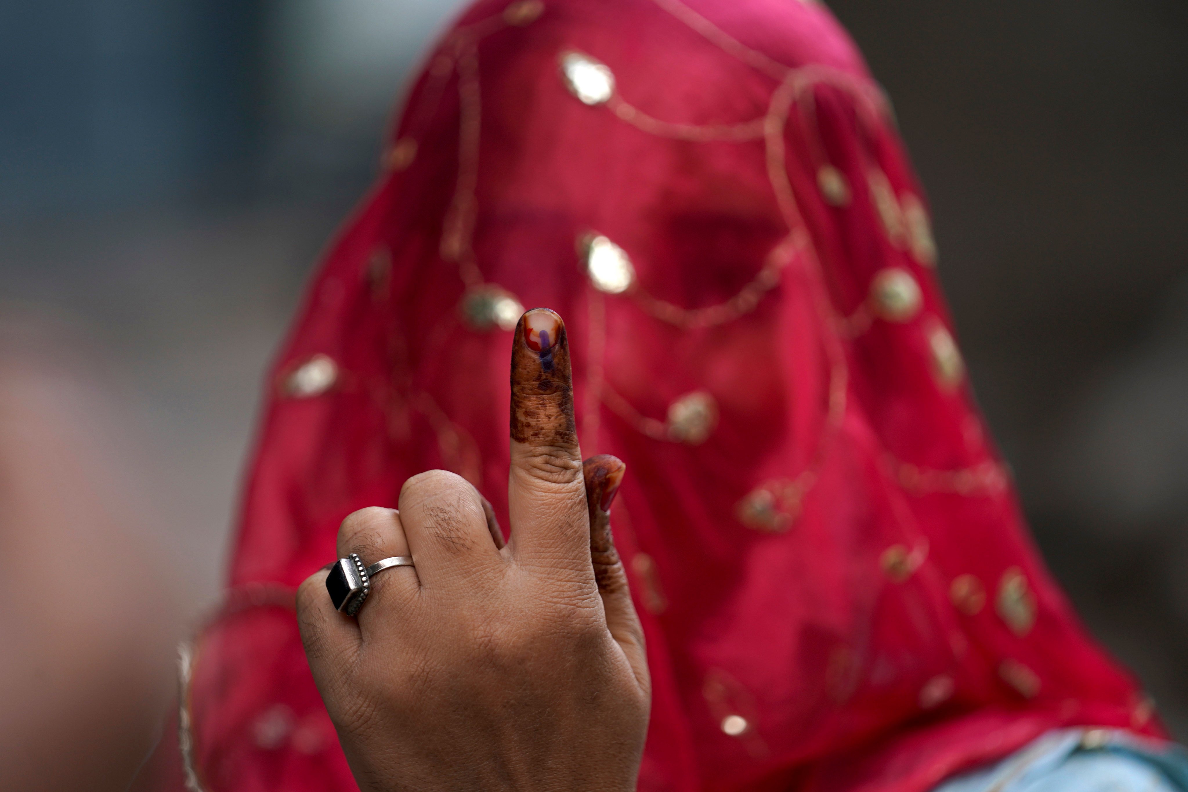 A woman in Hyderabad shows the indelible ink mark on her finger after casting her vote in November’s Telangana state assembly elections. Photo: AP