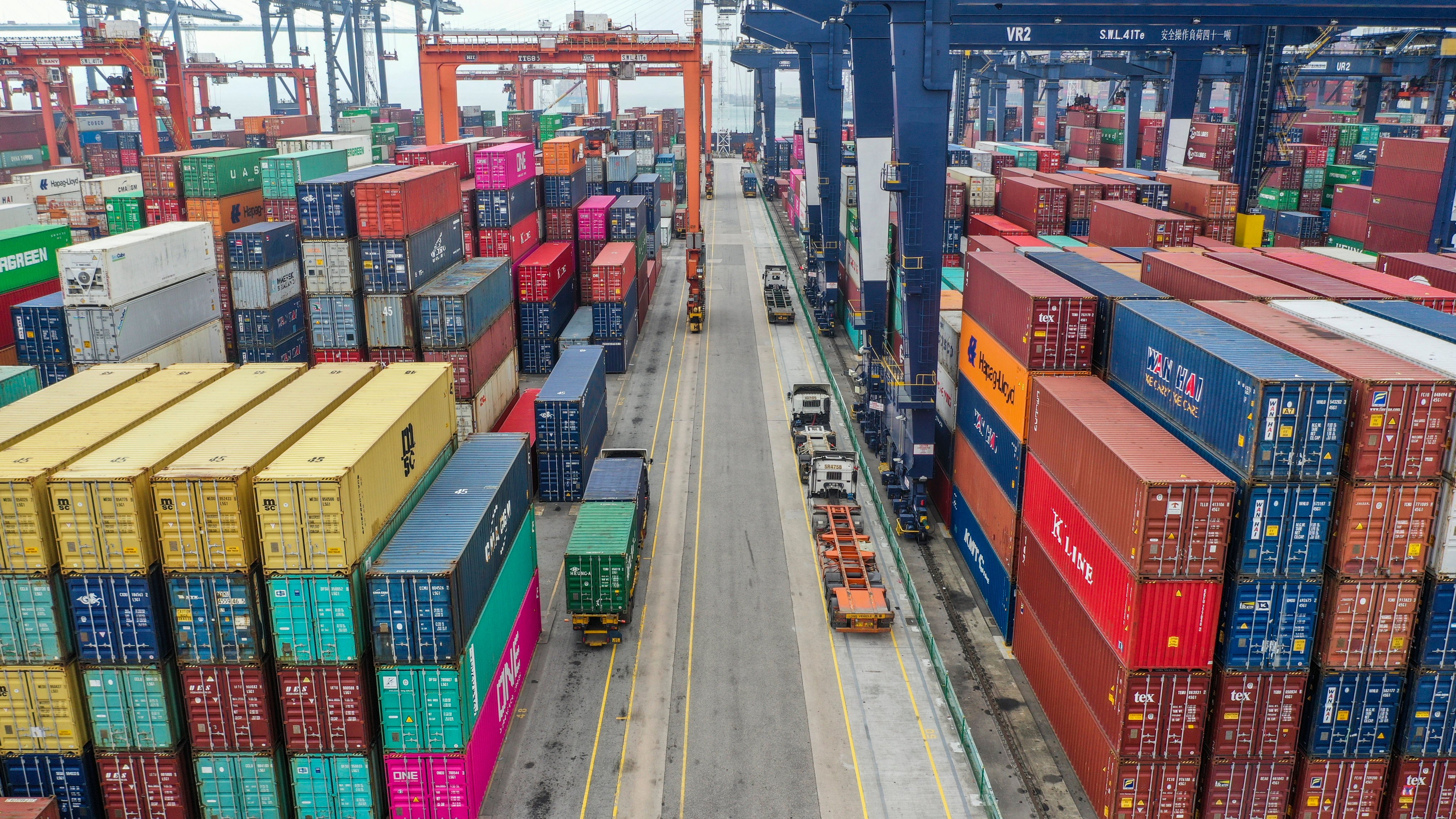 Trucks passing through containers at the Hong Kong Container Terminal, situated in the Kwai Chung-Tsing Yi basin on May 17, 2019. Photo: SCMP / Roy Issa