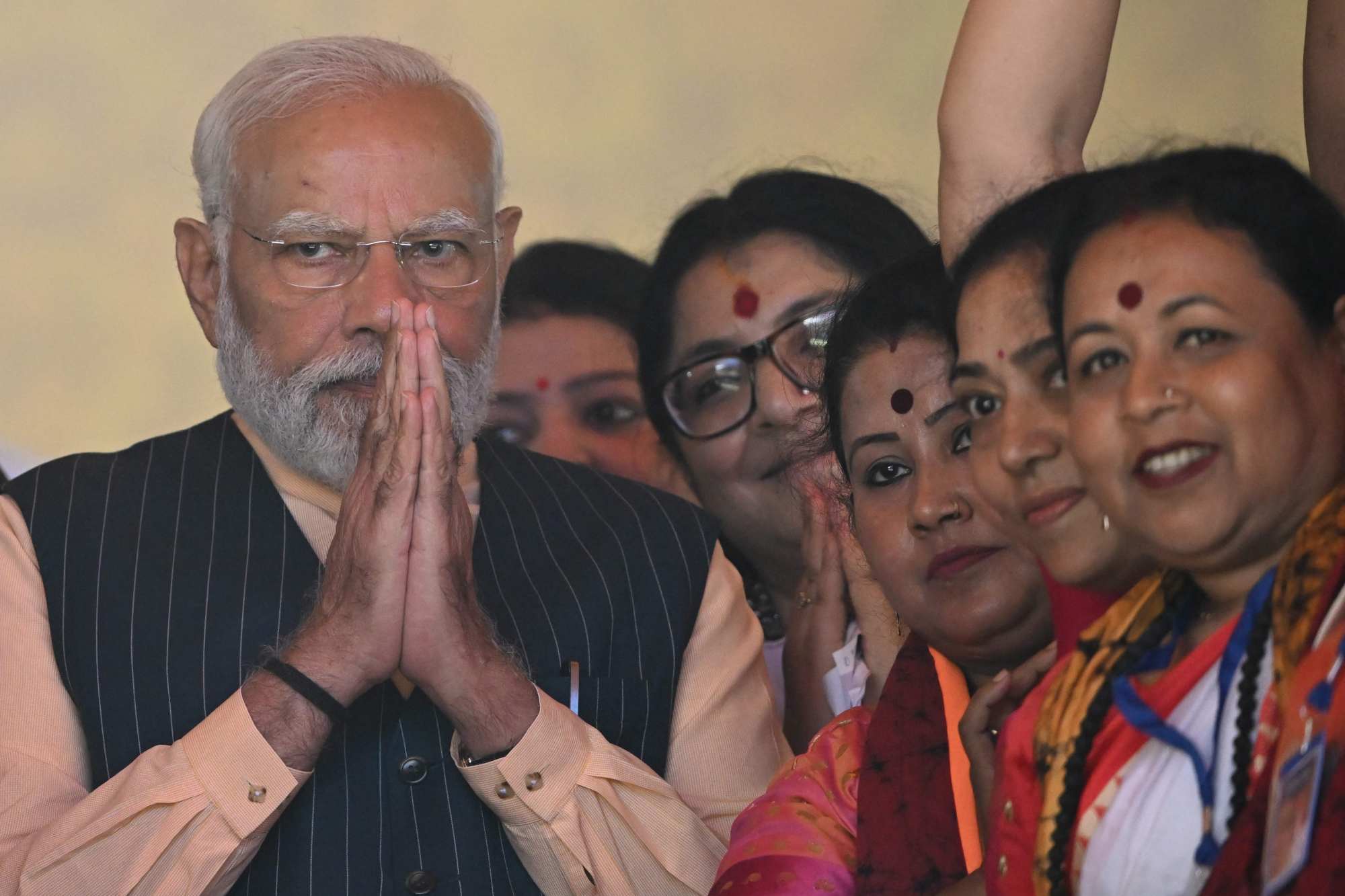Indian Prime Minister Narendra Modi gestures to supporters at Bharatiya Janata Party public meeting in Barasat, on the outskirts of Kolkata, on March 6. Photo: AFP