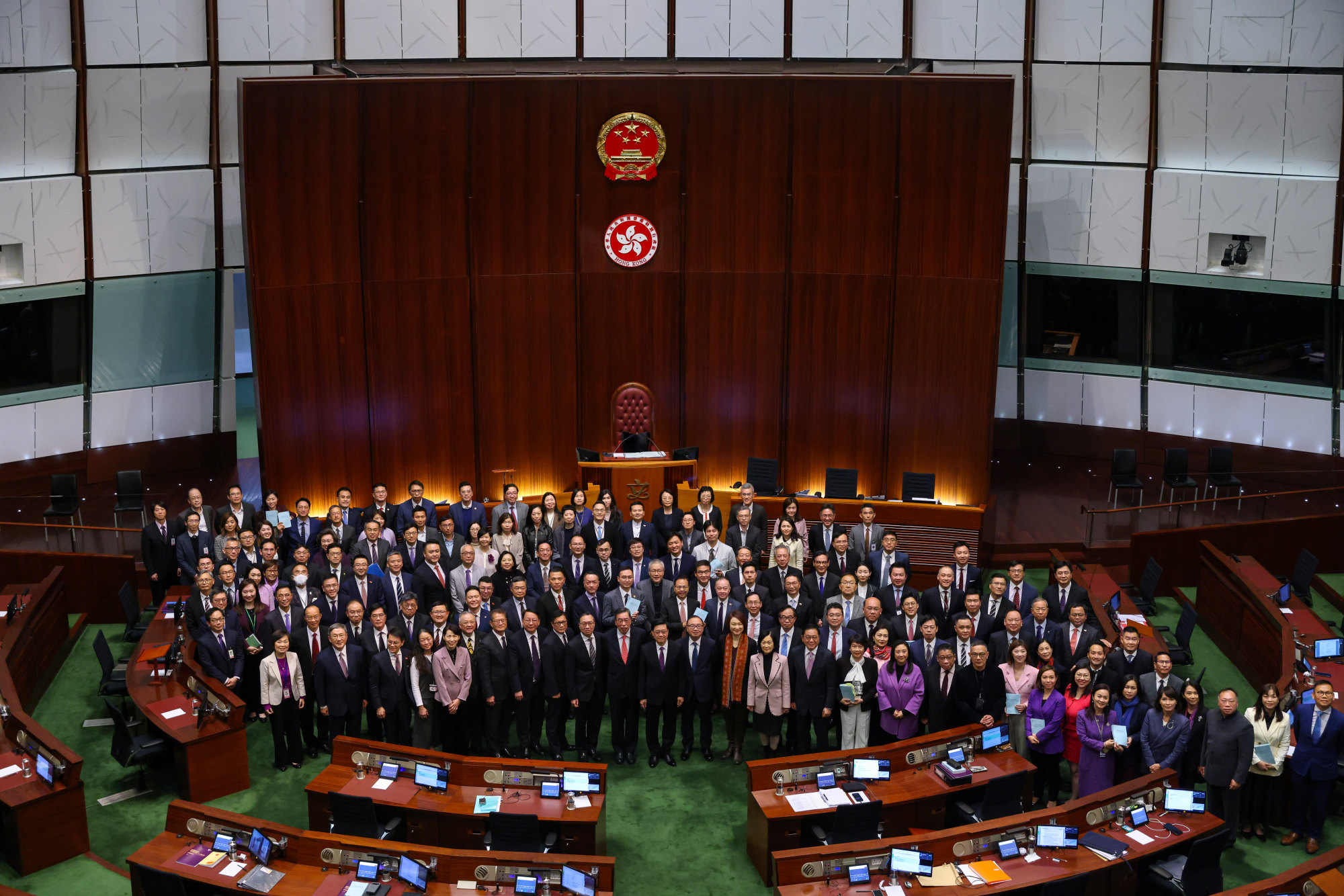 Lawmakers and government officials pose in Legco after a marathon session to pass the Article 23 legislation. Photo: Yik Yeung-man