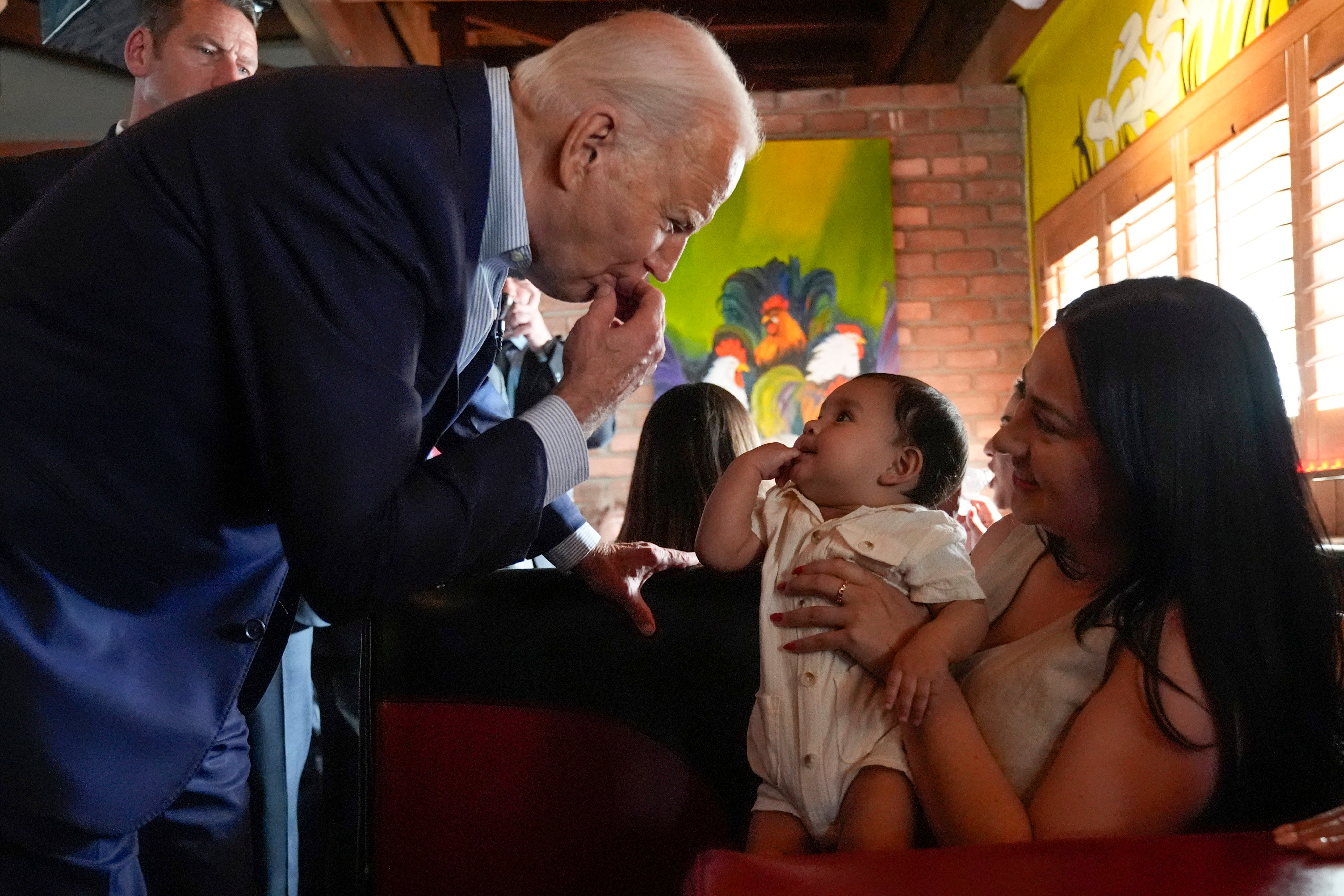 US President Joe Biden mimics a baby at a Mexican restaurant in the Phoenix area, Arizona. Photo: AP
