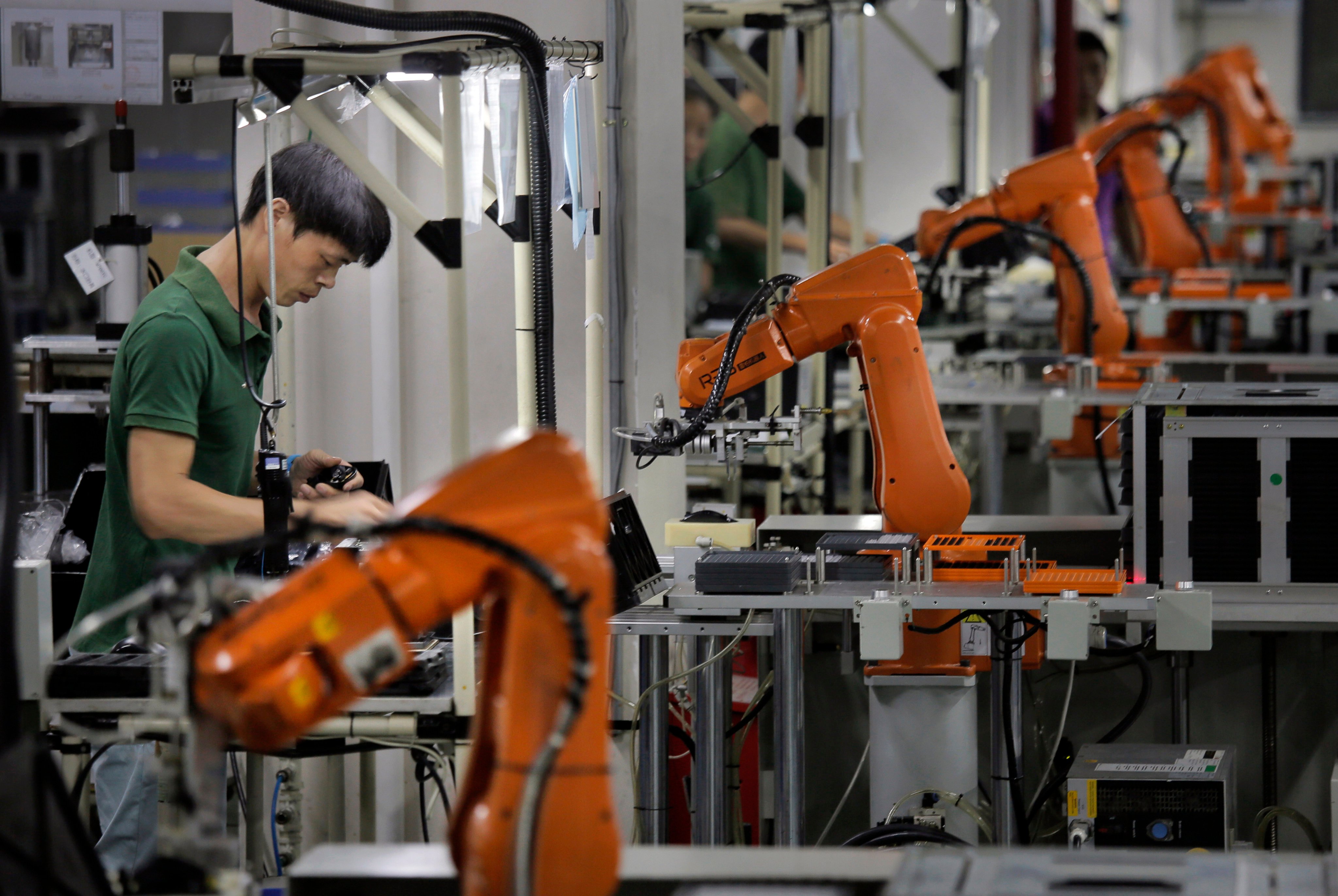 Robotic arms are seen at a factory in China’s Shenzhen, which saw a big rise in exports to kick off the year. Photo: AP