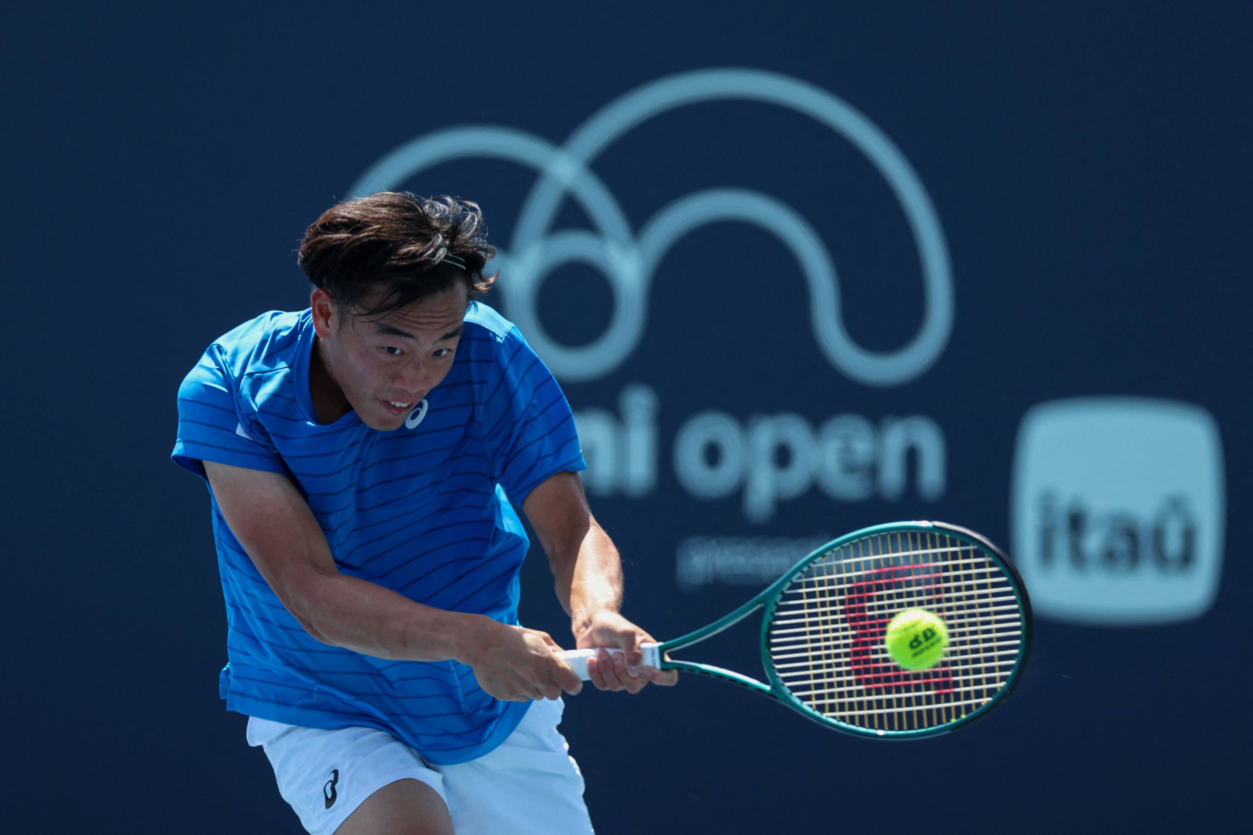 Coleman Wong returns a shot from Sumit Nagal during his men’s singles qualifying match at Hard Rock Stadium. Photo: Getty Images