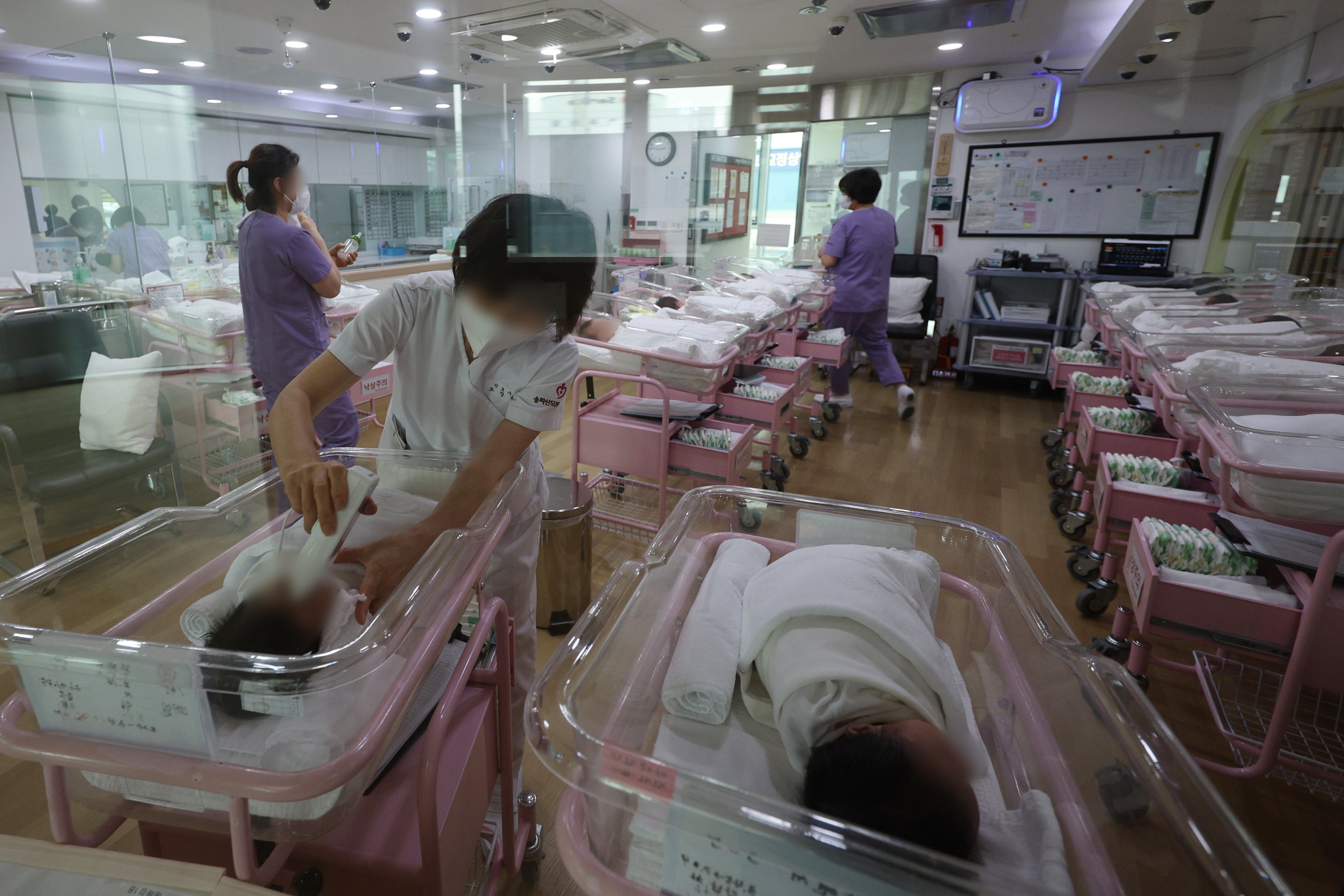 Nurses take care of babies at a postnatal care centre in Seoul, South Korea. According to a study, the population of three quarters of all countries will be shrinking by 2050. Photo: EPA-EFE/Yonhap