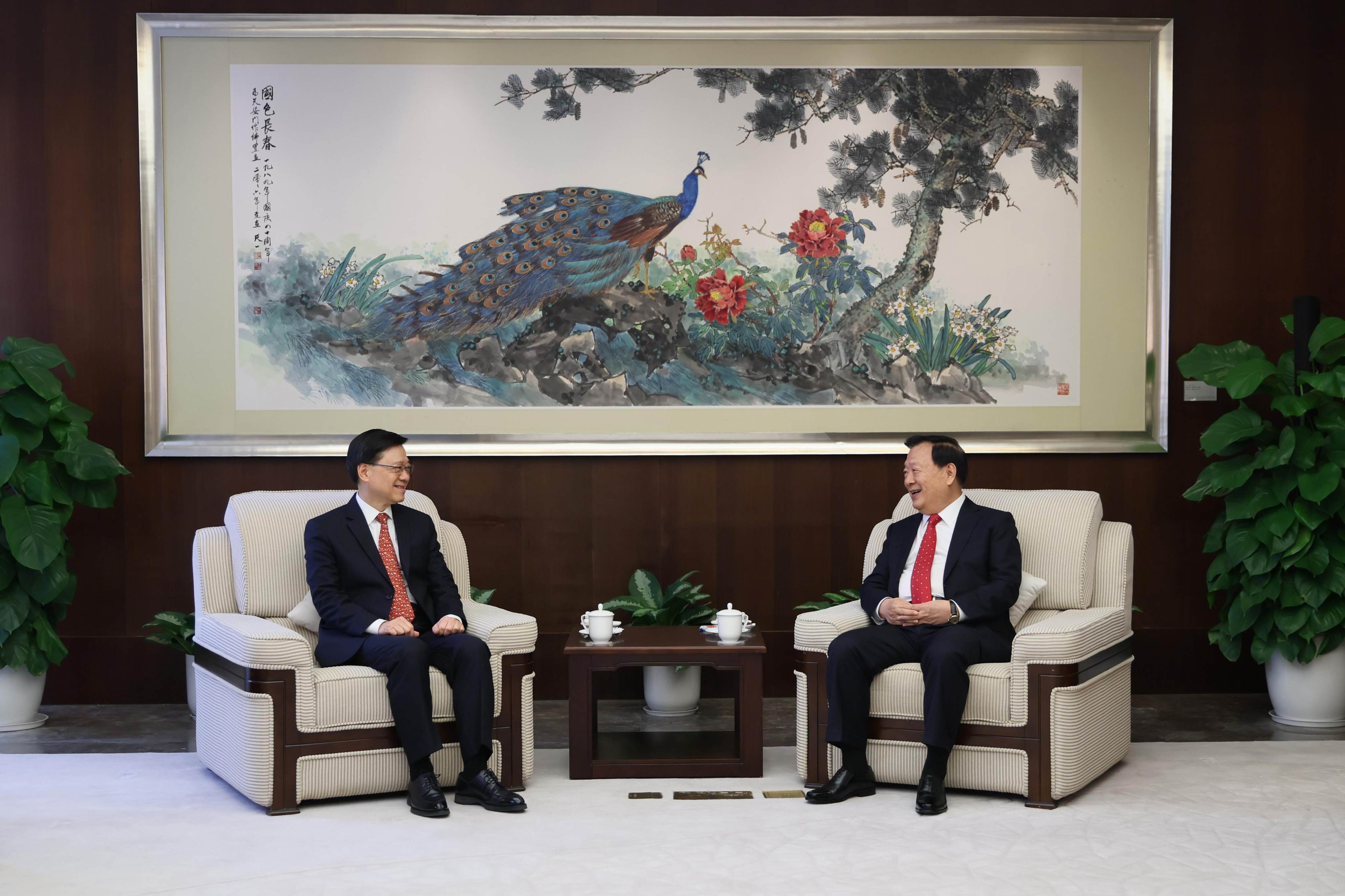 City leader John Lee (left) meets Xia Baolong, director of the Hong Kong and Macau Affairs Office. Photo: Handout 
