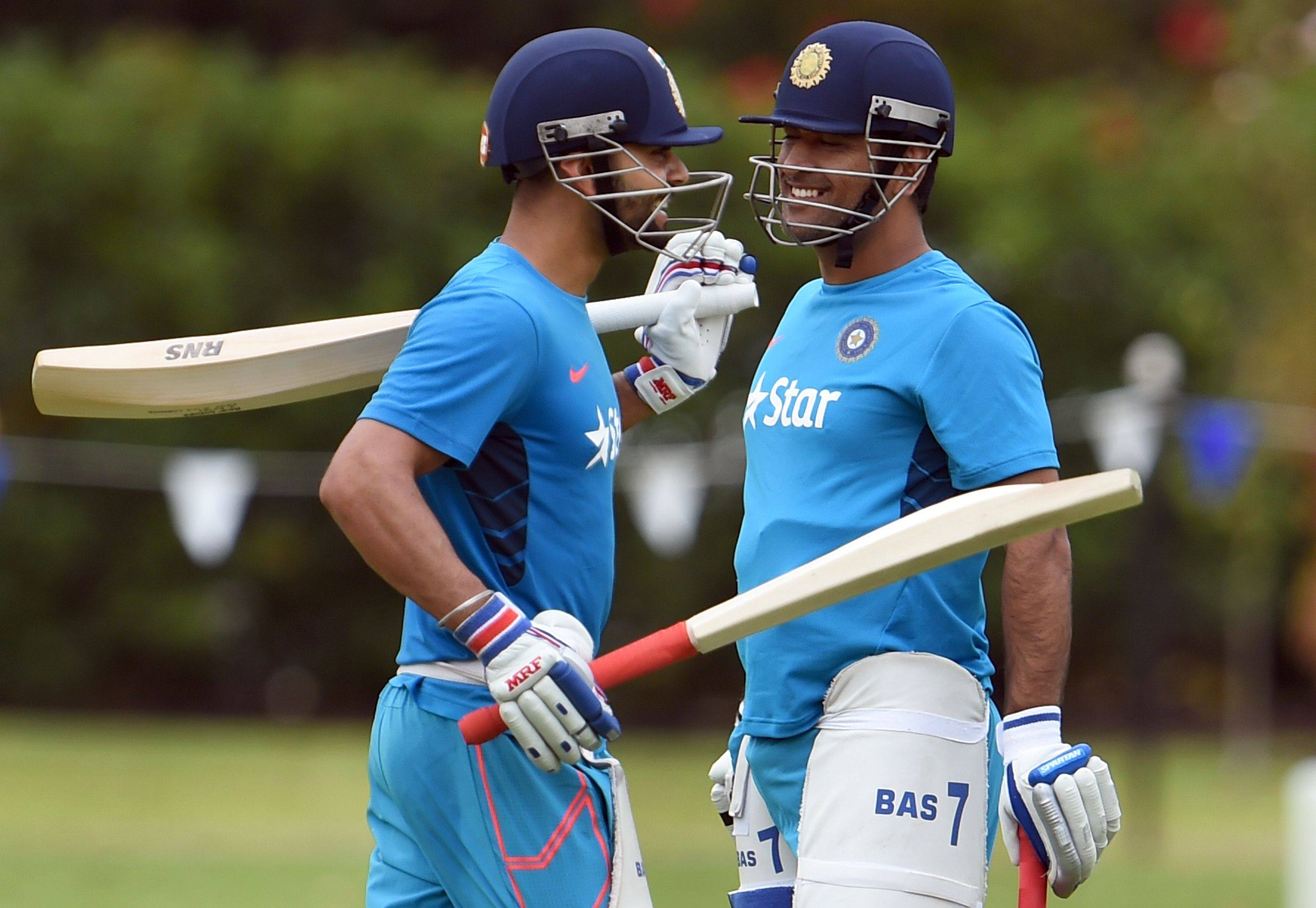 Two of the biggest names in Indian cricket, MS Dhoni (right) and Virat Kolhi, will face each other in the opening match of the Indian Premier League season.  Photo: AFP 