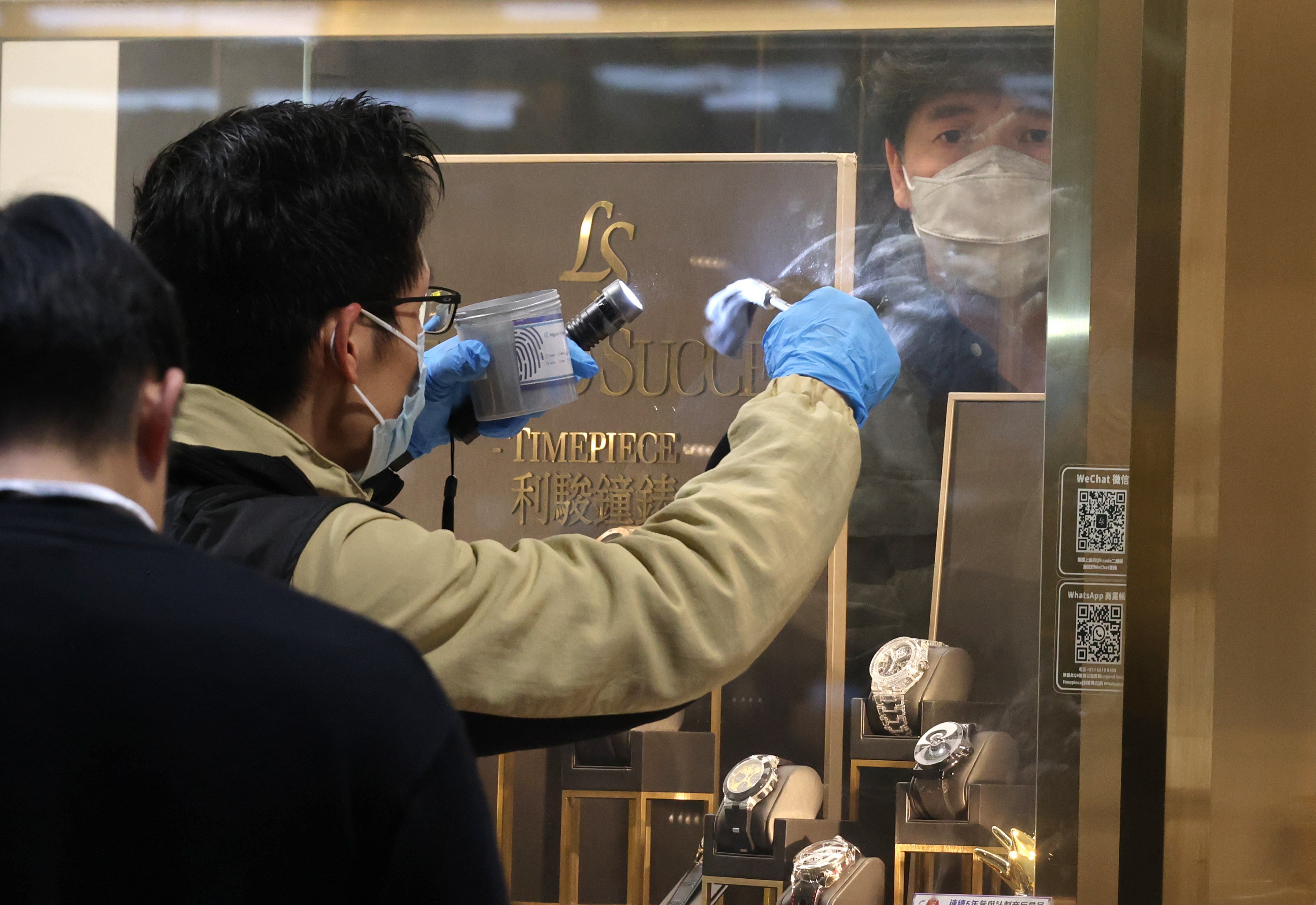 Police investigate at the Legend Success Timepiece store in Foo Ming Street, Causeway Bay on February 28, after it was robbed. Seven watch shops and goldsmiths were robbed last year, up from three in 2022. Photo: Jelly Tse