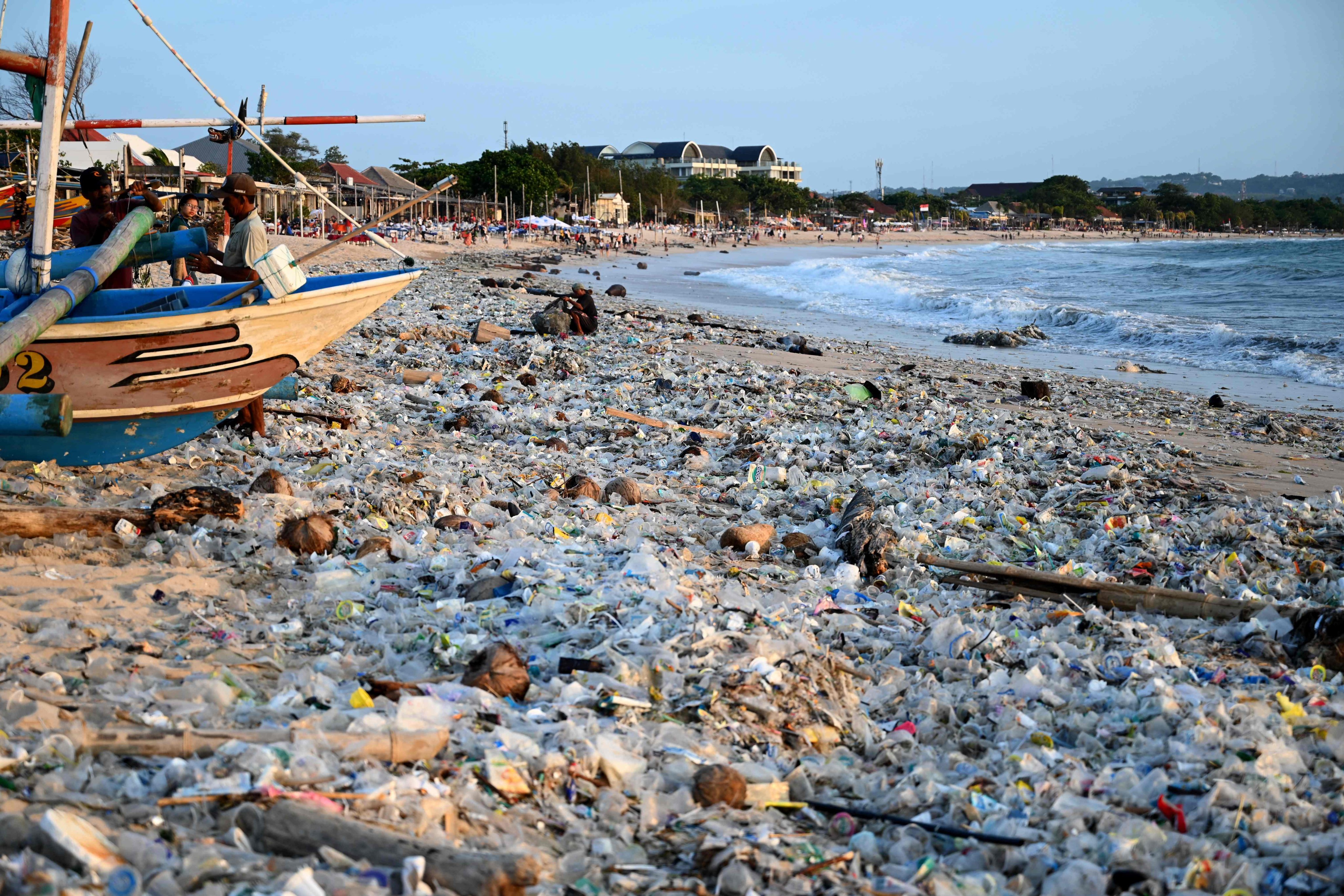 Plastic and other debris is seen washed ashore at a beach in Denpasar on Indonesia’s resort island of Bali earlier his month. Investments are needed to clean up plastic pollution and reduce greenhouse gases. Photo: AFP