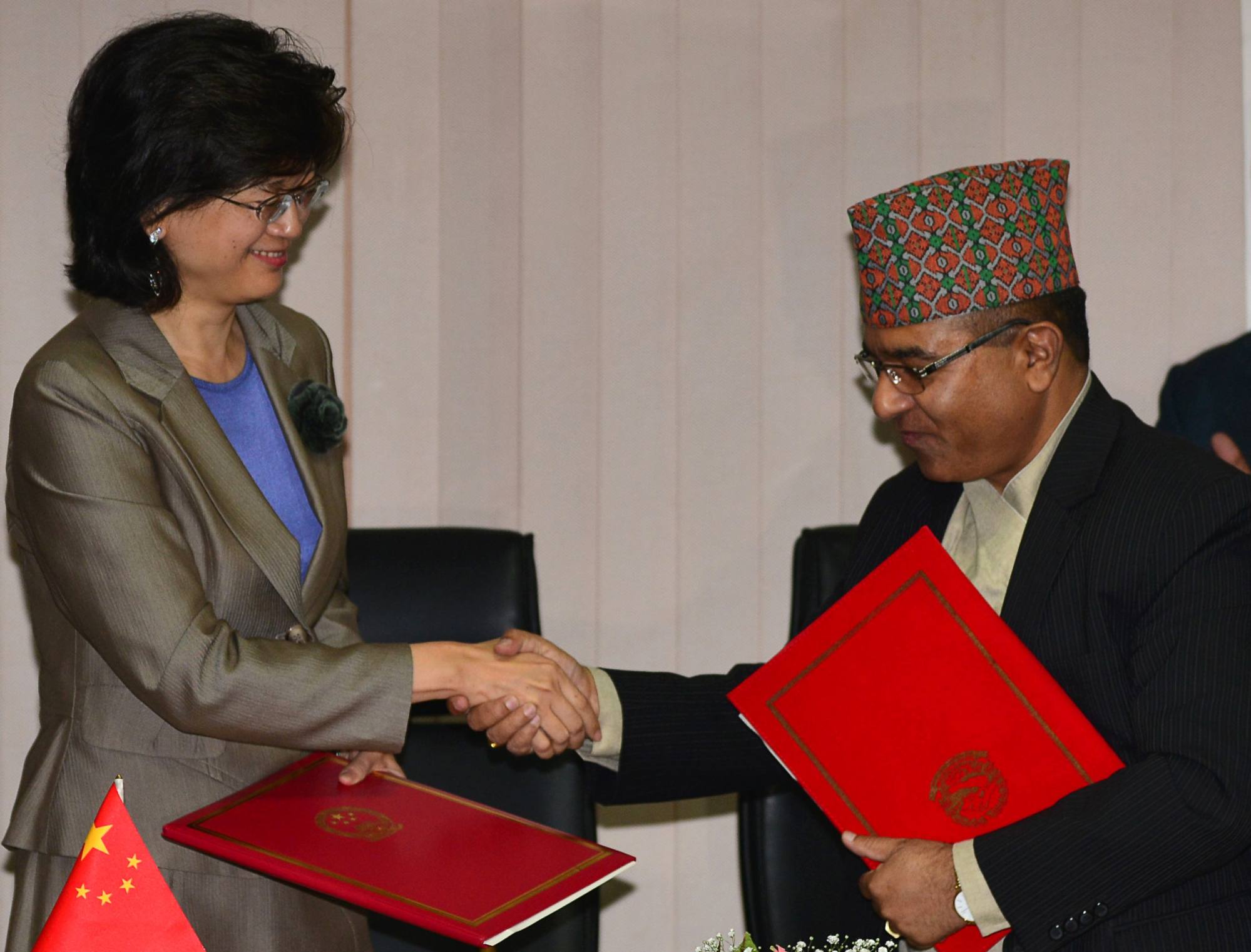 Nepal’s Foreign Secretary Shankar Das Bairagi and China’s Ambassador to Nepal Yu Hong (left) exchange documents during a signing ceremony relating to the Belt One Road initiative in Kathmandu in May 2017. File photo: AFP
