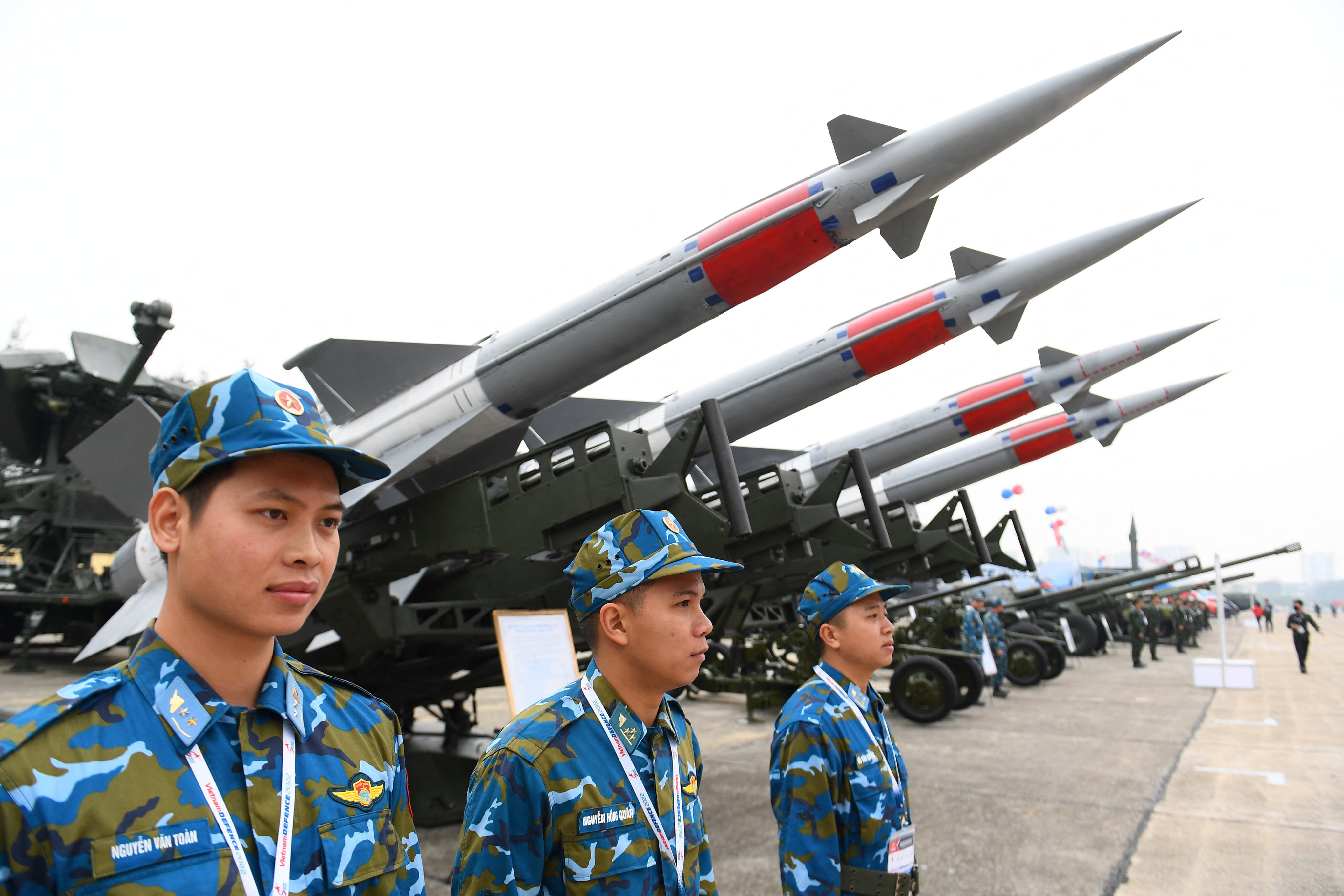 Vietnamese soldiers stand next to missiles on display at the country’s first international defence expo in Hanoi in December 2022. Photo: AFP