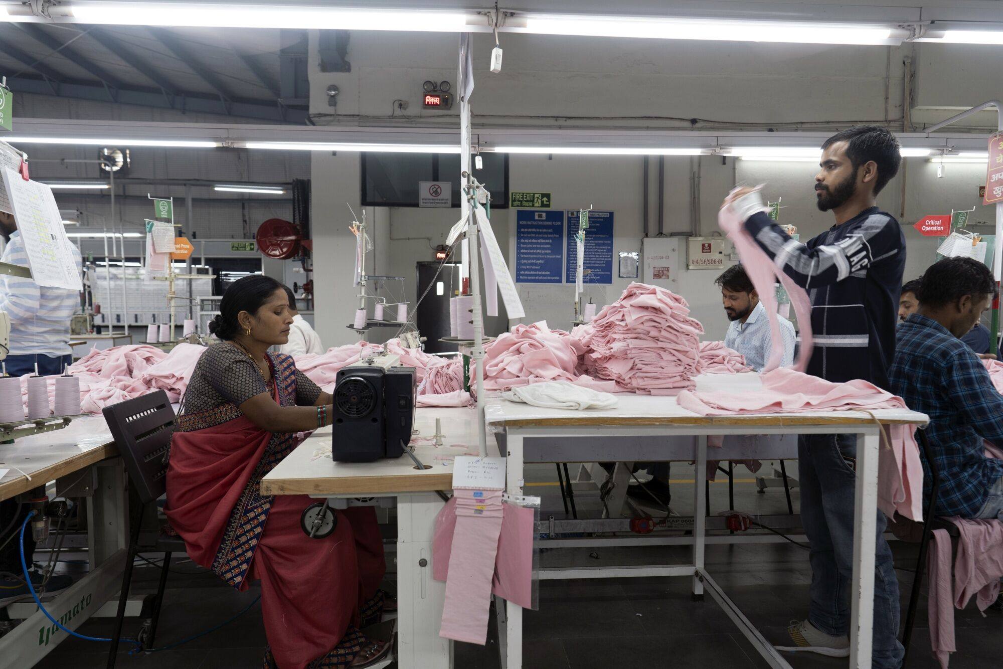 Workers make clothing for Ralph Lauren Corp. at a factory in Gurugram earlier this month. Observers say some of India’s neighbours have better positioned themselves for garment production. Photo: Bloomberg