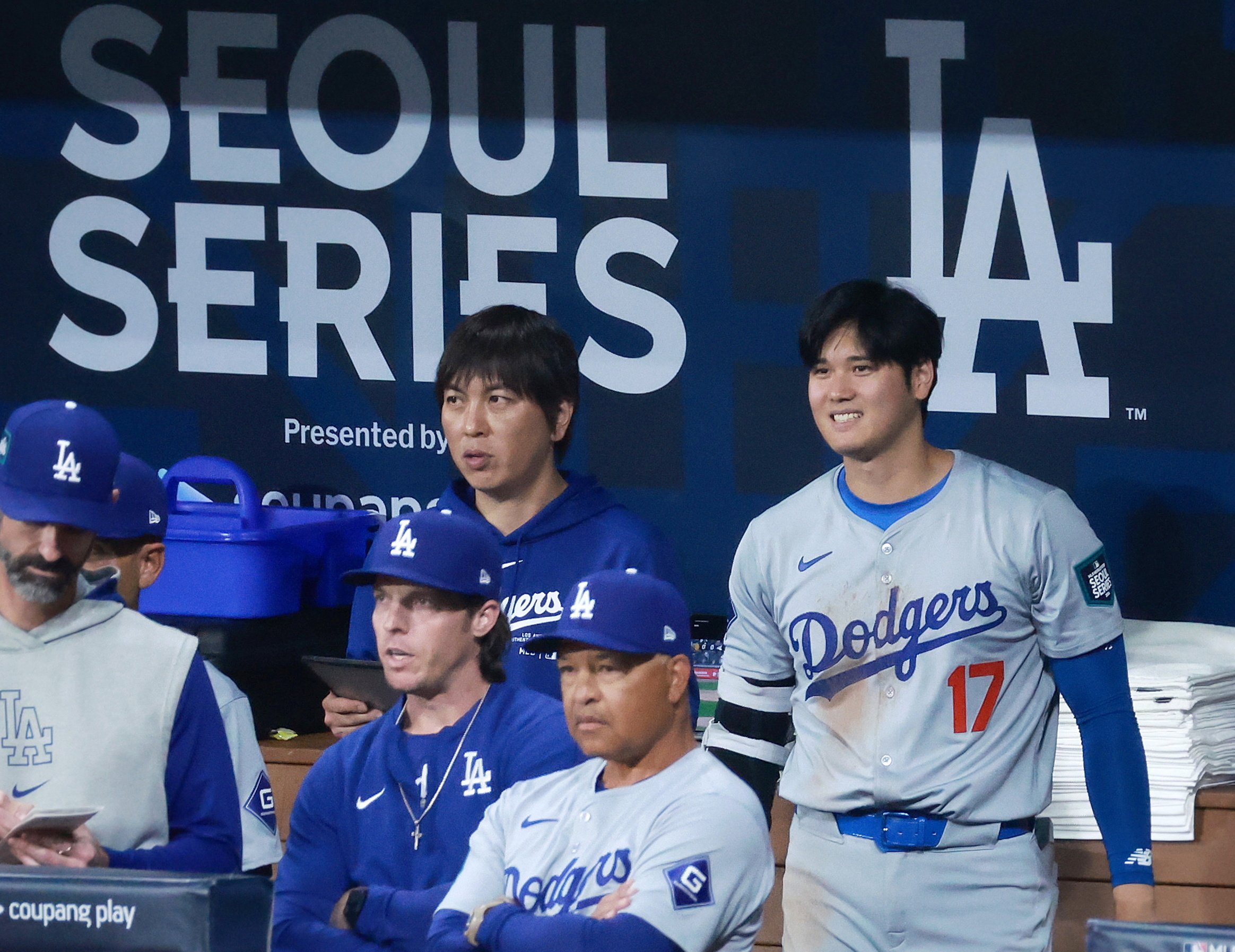 LA Dodgers star Shohei Ohtani (right) and his interpreter Ippei Mizuhara (left) watch the Dodgers’ MLB season-opening game against the San Diego Padres in Seoul. Photo: EPA-EFE