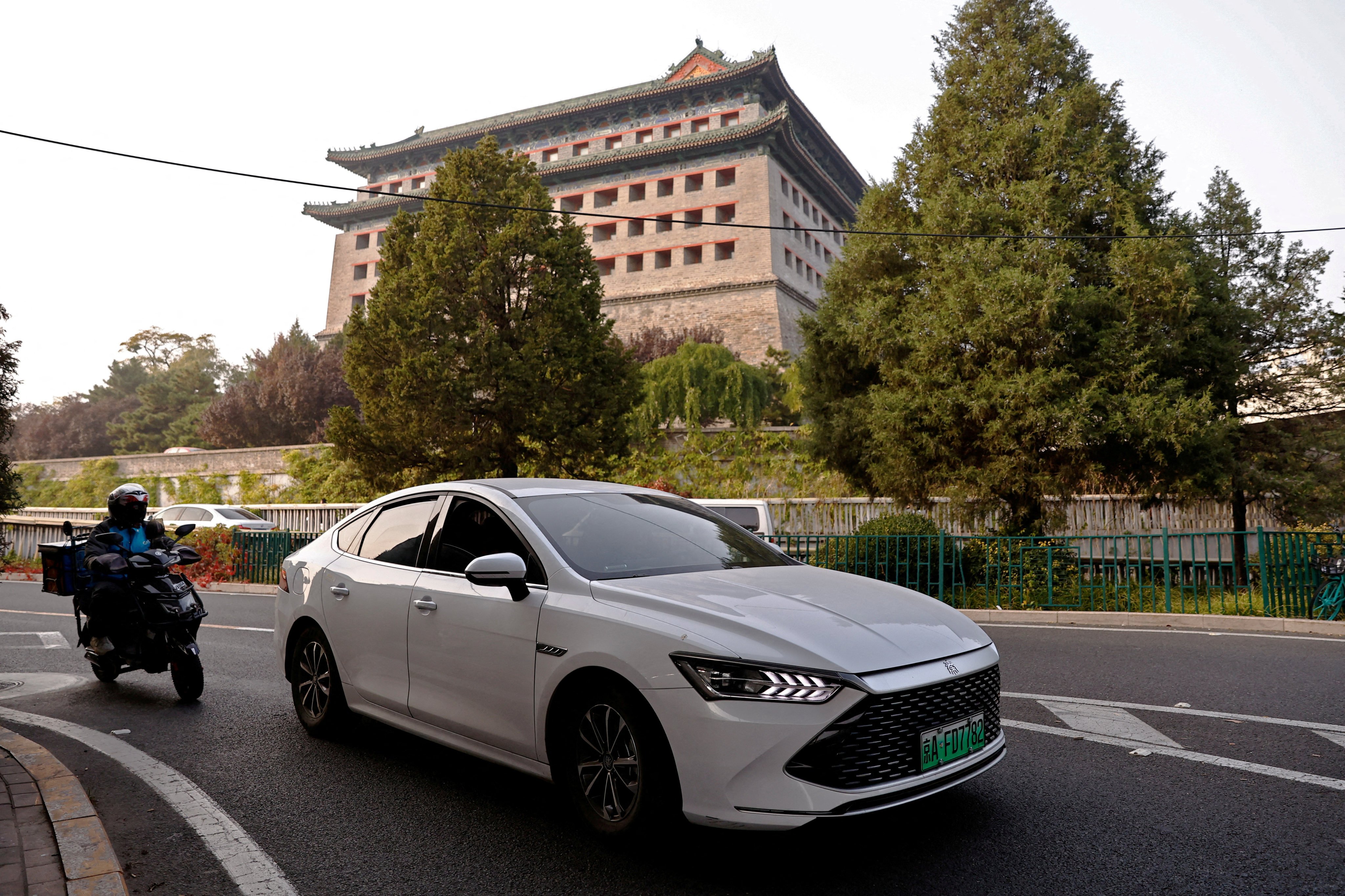 An electric vehicle from Chinese manufacturer BYD drives along a street in Beijing. For China to avoid overcapacity there must be sufficient final demand for new advanced manufactured goods. Photo: Reuters