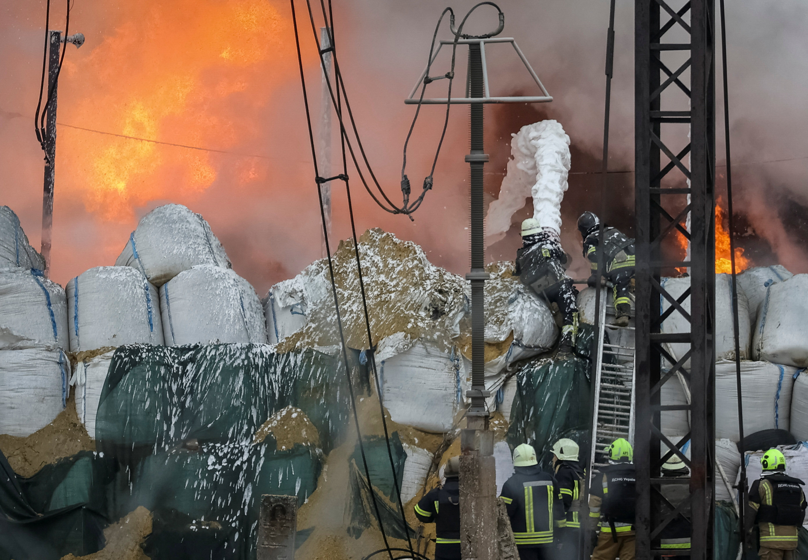 Firefighters work at a site of a critical power infrastructure object, which was hit during Russia’s missiles strike, outside Kharkiv. The Kremlin has until now insisted that the attack on Ukraine ordered on February 24, 2022, was described only as a “special military operation”. Photo: Reuters