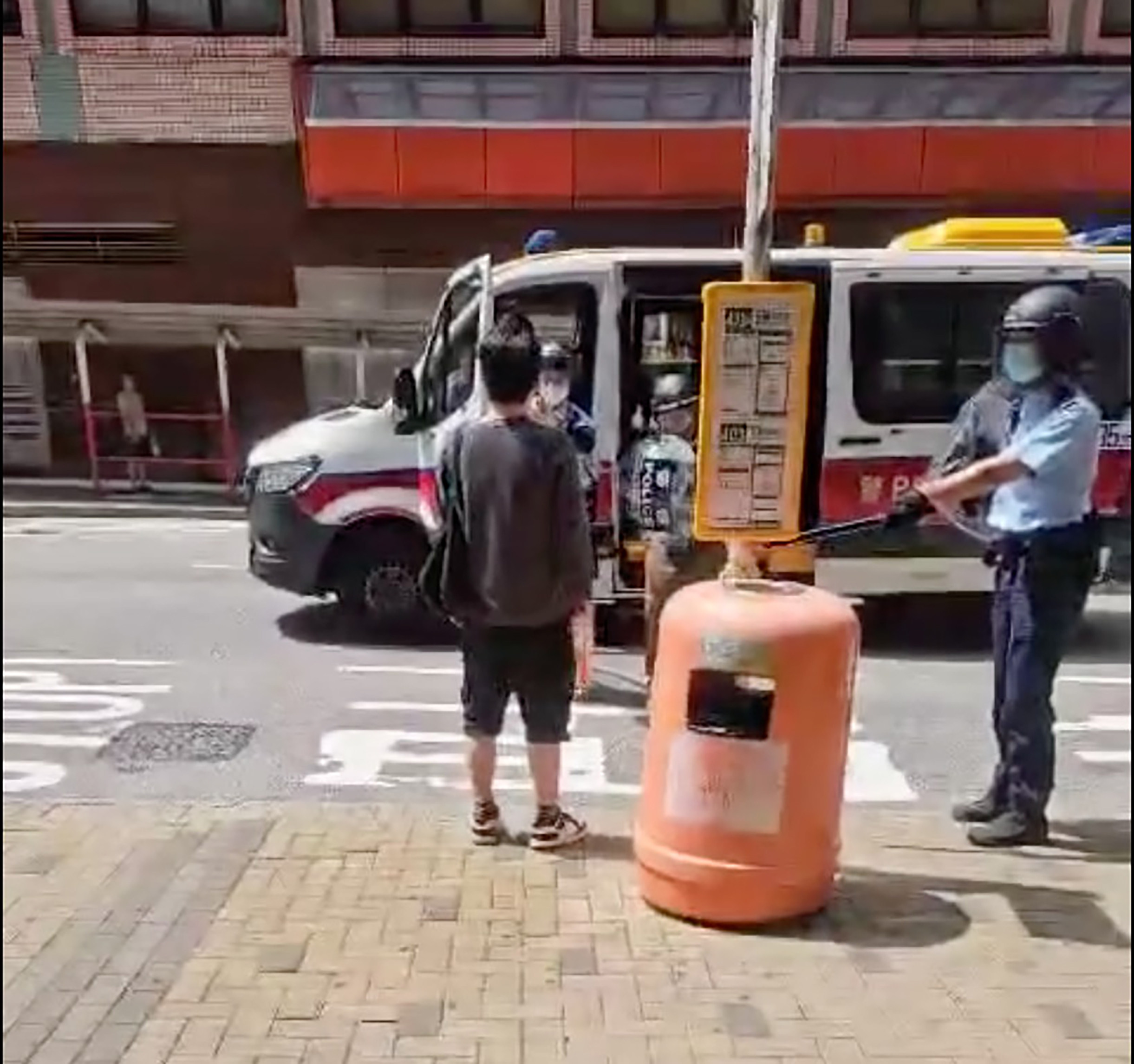 A video posted online shows three officers ordering a man to drop a knife. Photo: Facebook / @ 香港突發報料區