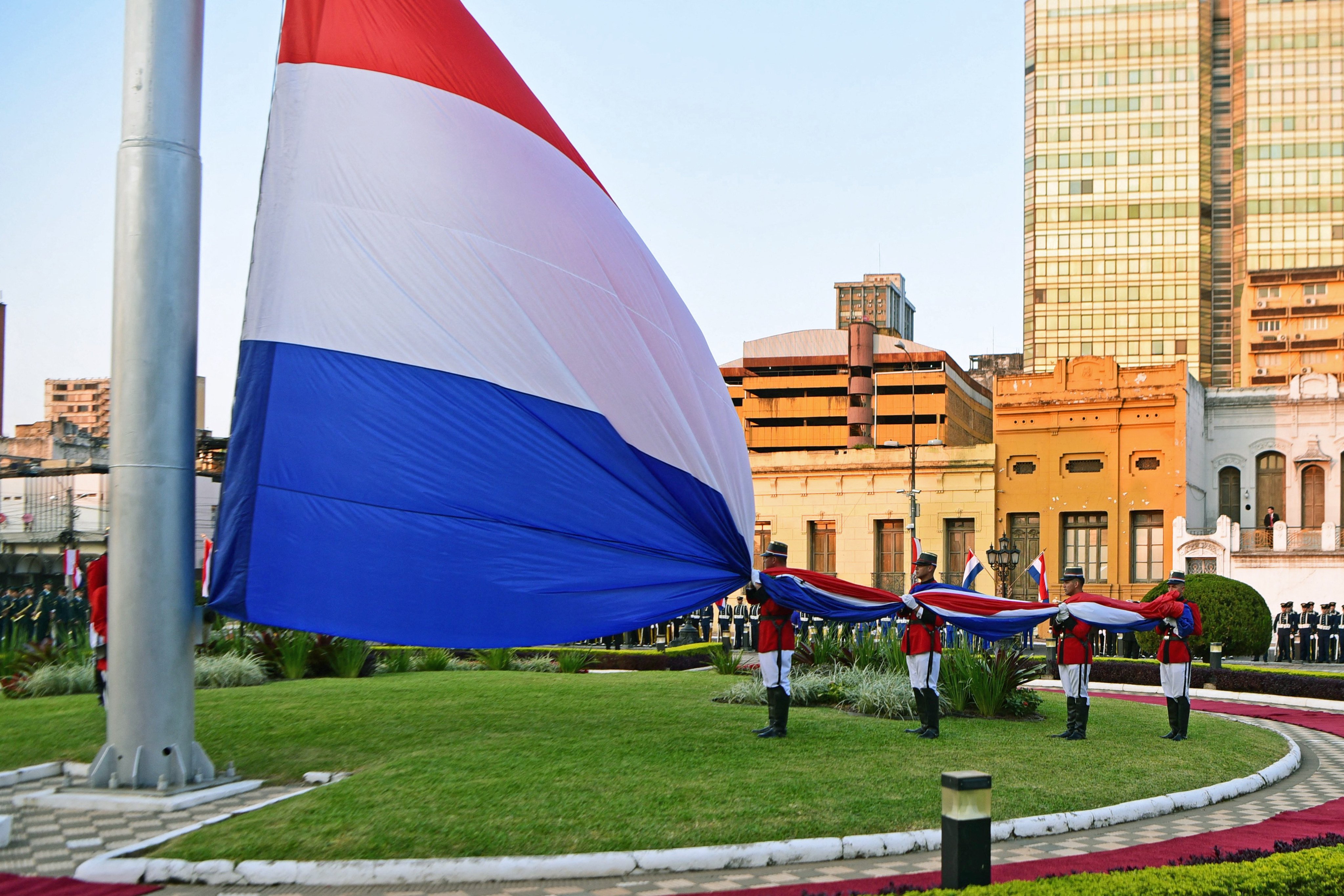 Paraguay’s national flag is hoisted outside the country’s presidential palace in Asuncion. Photo: AFP