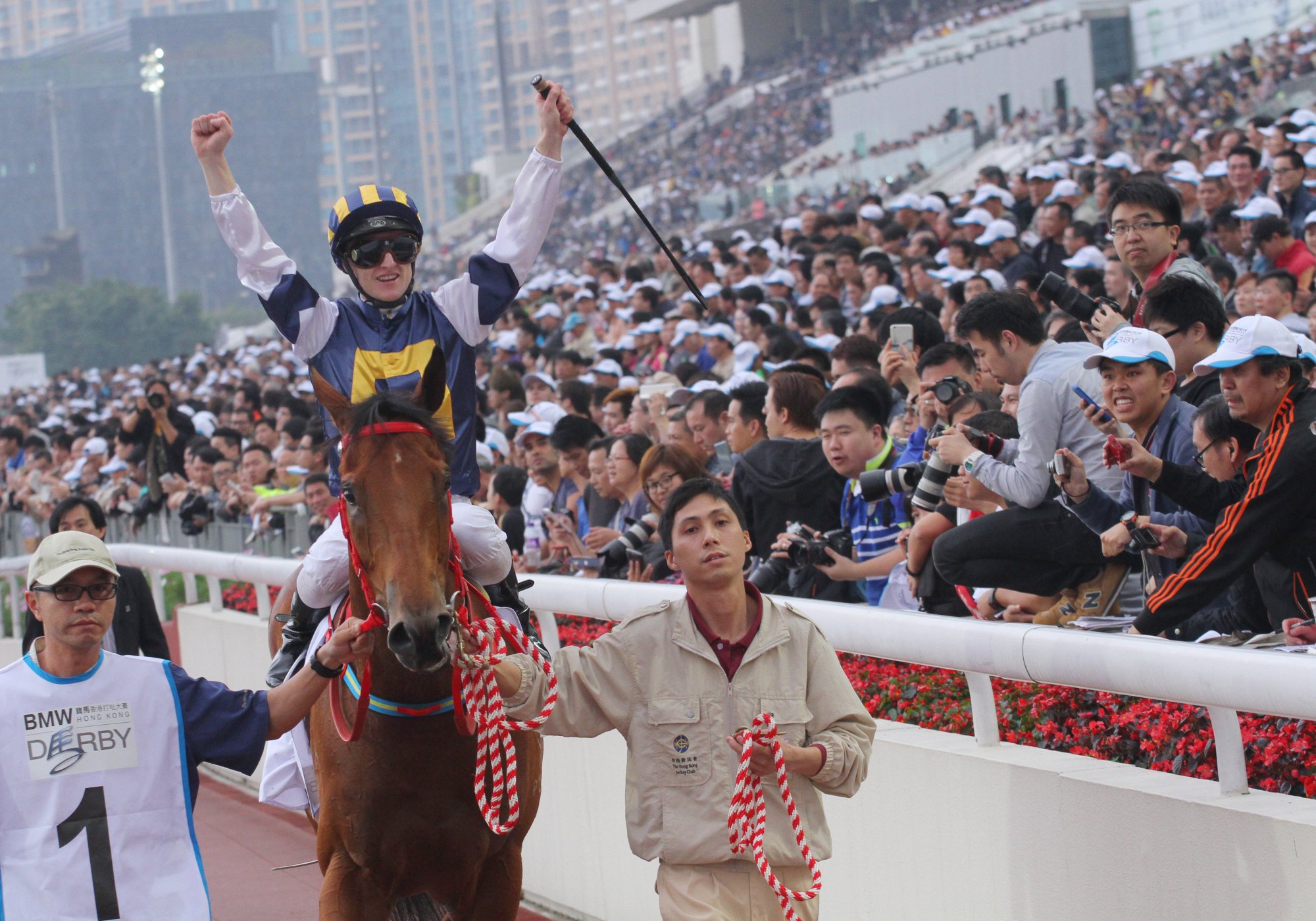 Zac Purton returns to the winner’s enclosure aboard Luger after the 2015 Hong Kong Derby.