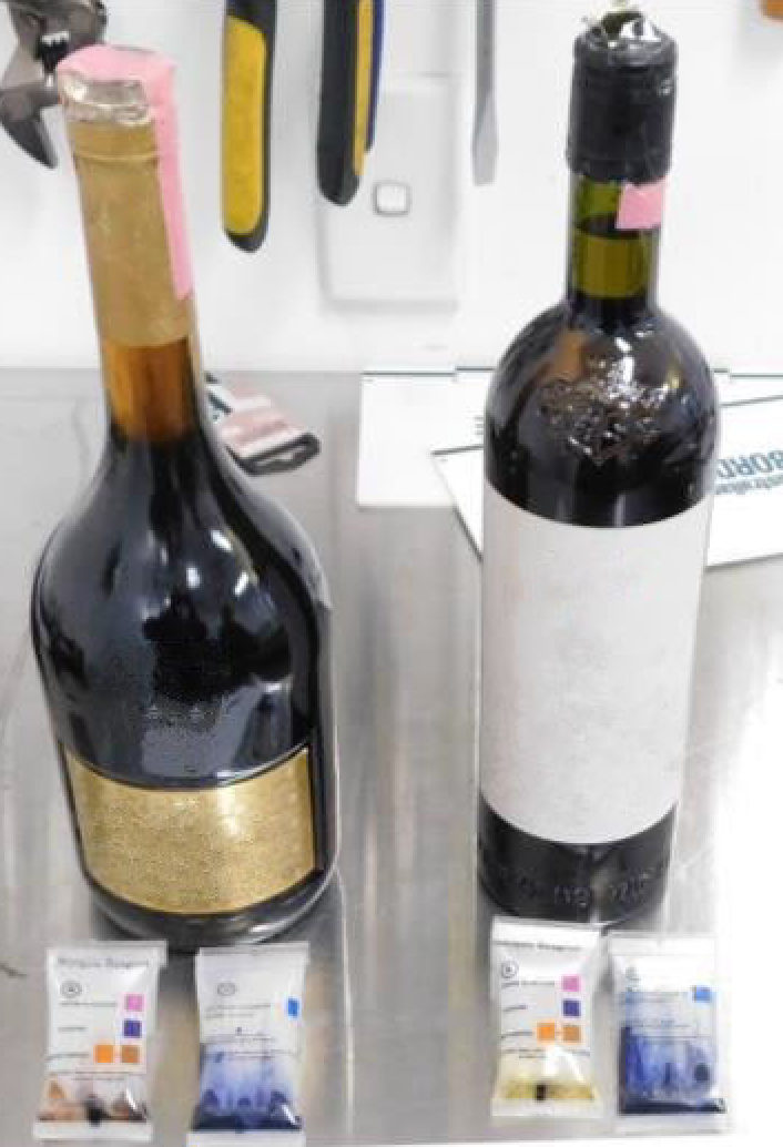 Wine bottles that Australian police say were used in the smuggling attempt by a Taiwanese man. Photo: Australian Border Force / Handout
