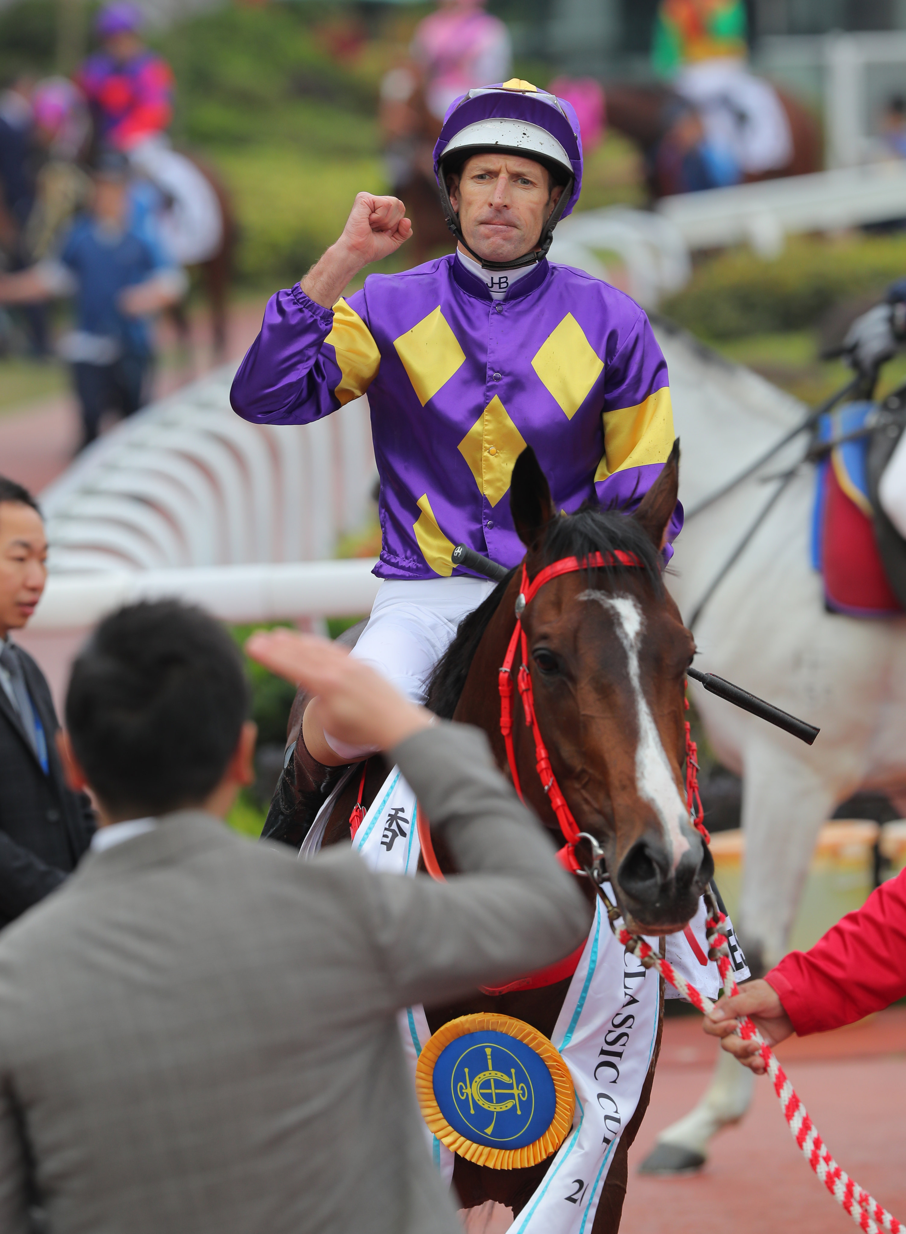 Hugh Bowman celebrates after winning the Classic Cup aboard Helios Express. Photo: Kenneth Chan