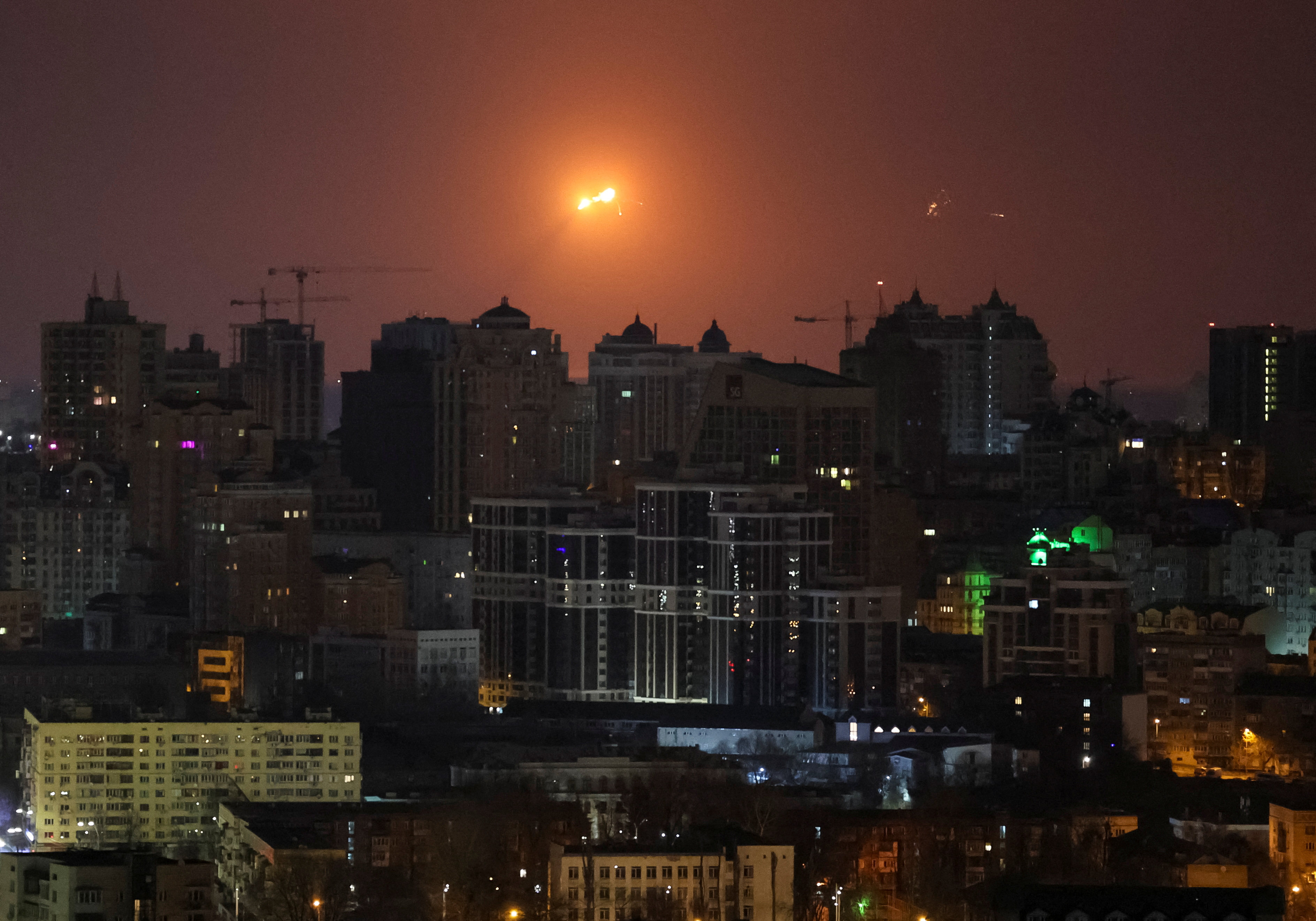 A missile explodes in the sky over Kyiv during a Russian missile strike on the Ukrainian capital early on Sunday. Photo: Reuters