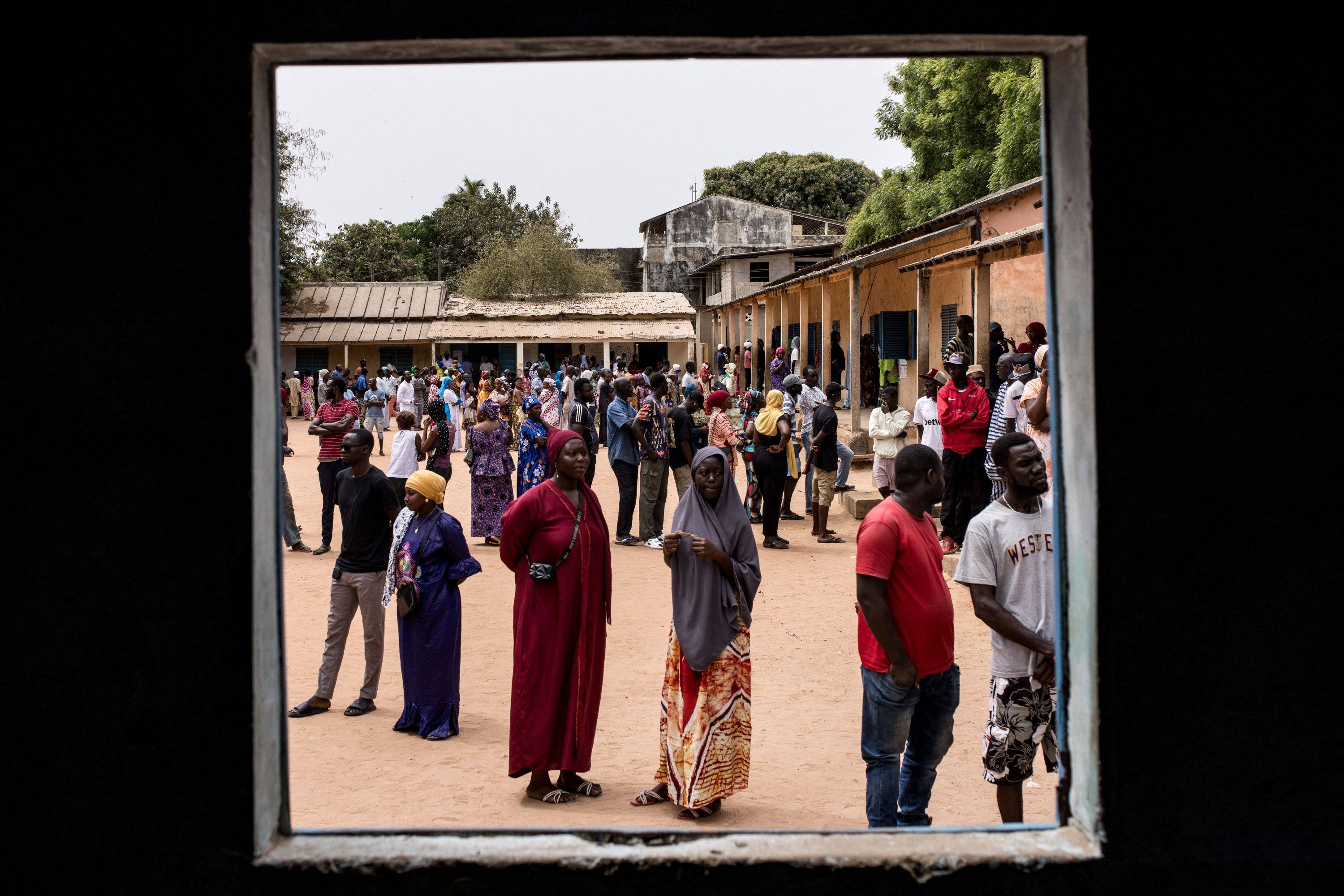 Voters wait to cast their votes outside a polling station in Ziguinchor, Senegal, on Sunday, during presidential elections. Two favourites have emerged: the ruling coalition’s former prime minister Amadou Ba and anti-establishment candidate Bassirou Diomaye Faye. Photo: AFP