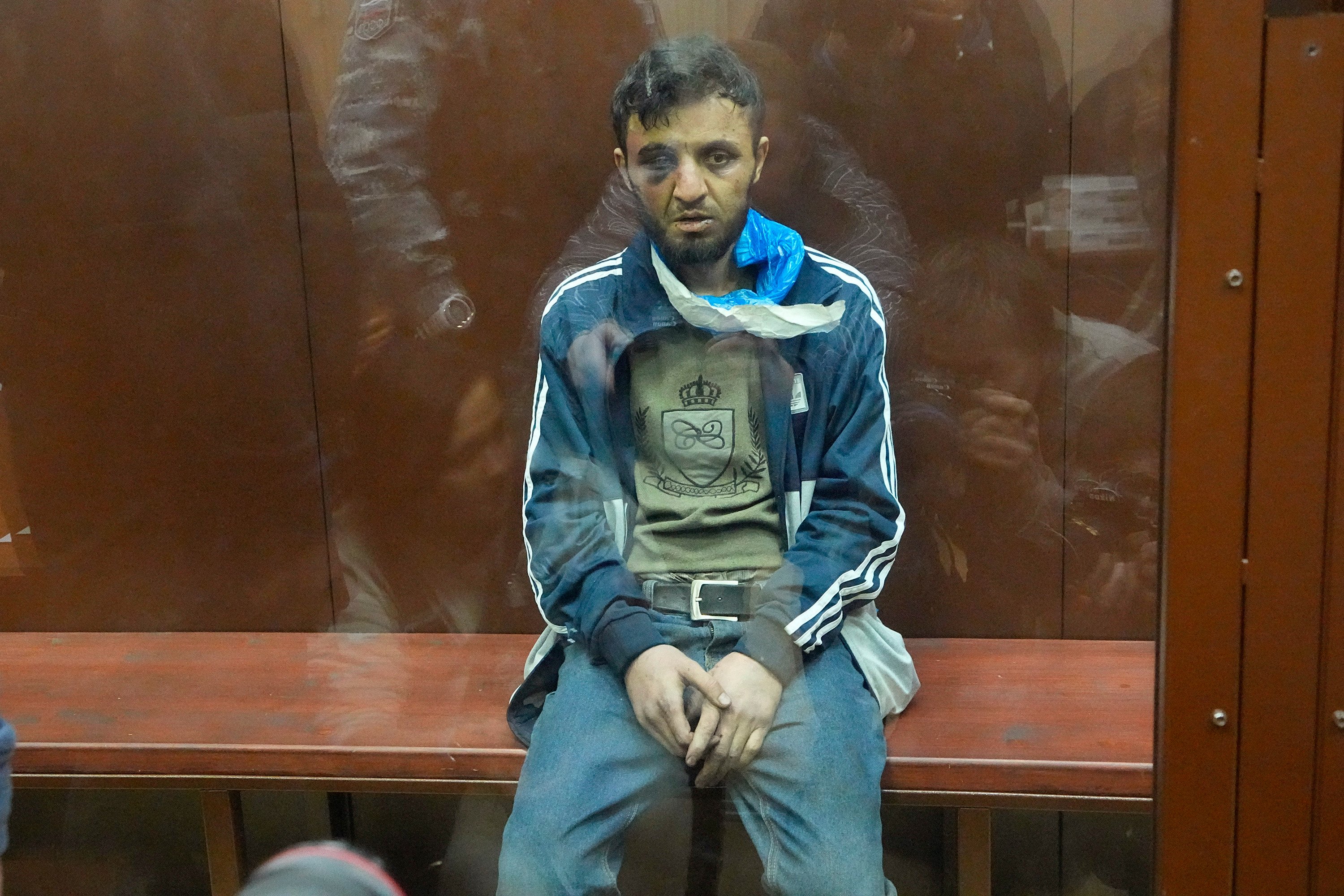 Dalerdzhon Mirzoyev, a suspect in Friday’s Crocus City Hall shooting, sits in a glass cage in the Basmanny District Court in Moscow, Russia on Sunday. Photo: AP 